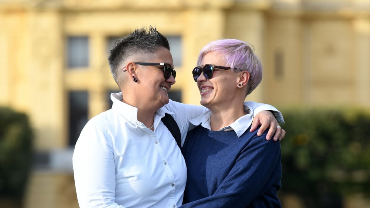 Lovers and former nuns Marita Radovanovic (R) and Fanika Feric, called "Fani" pose for a photograph on October 09, 2020, in Zagreb. - Marita was a young nun on a Croatian island when she first met Fani, a fellow sister who would become her great love. "I simply followed my heart," the 36-year-old says of their story -- the subject of a new, bold documentary in the staunchly Catholic country, where LGBTQ rights are restricted. Titled 'Nun of Your Business', the film premiered at the ZagrebDox international film festival over the weekend, scooping up an audience award. (Photo by DENIS LOVROVIC / AFP)