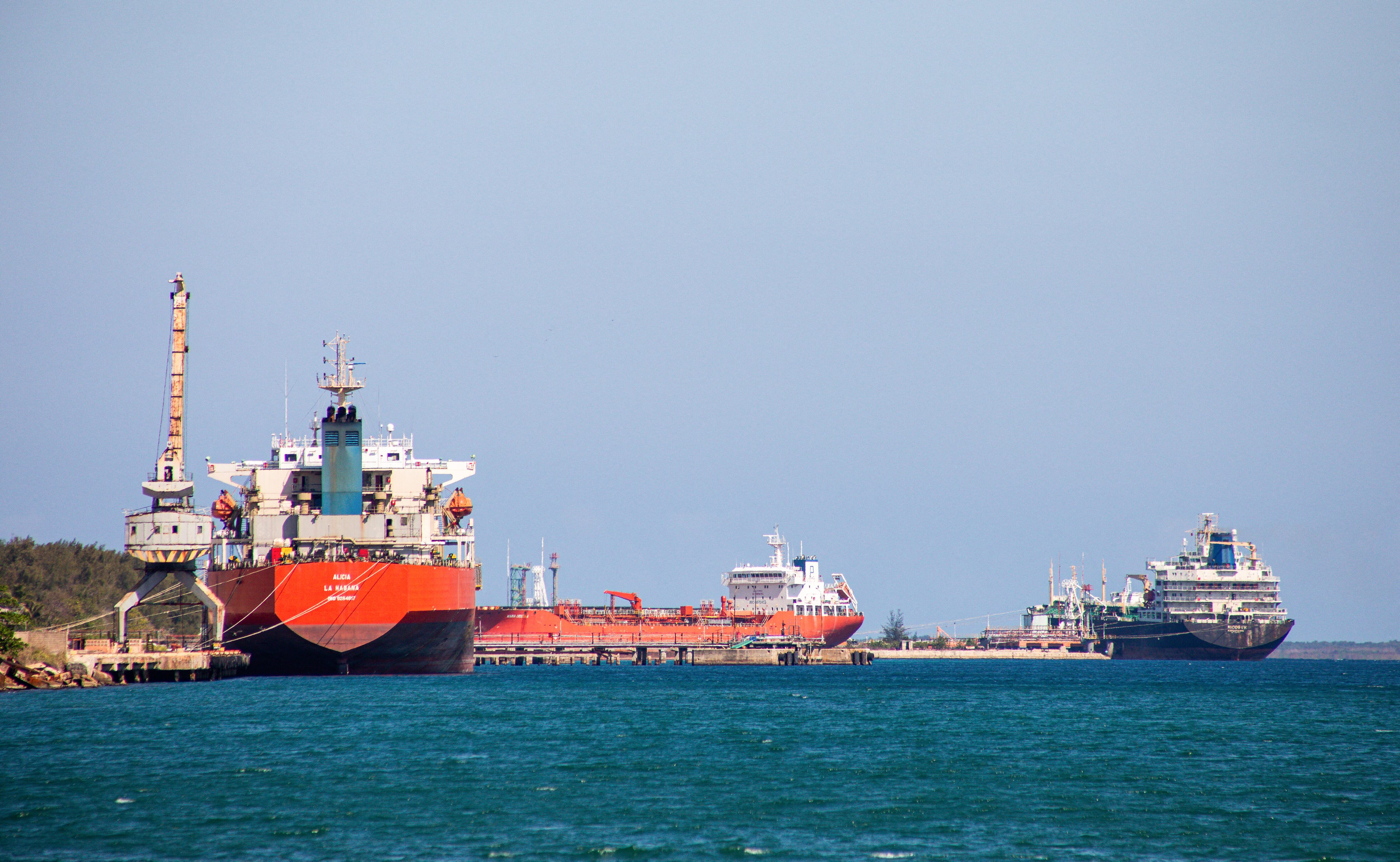 The Nicos I.V. oil tanker (R), sailing under the flag of Saint Vincent and the Grenadines, is seen alongside other tanker vessels in the port of Matanzas, Cuba, on February 17, 2026. (Photo by AFP)