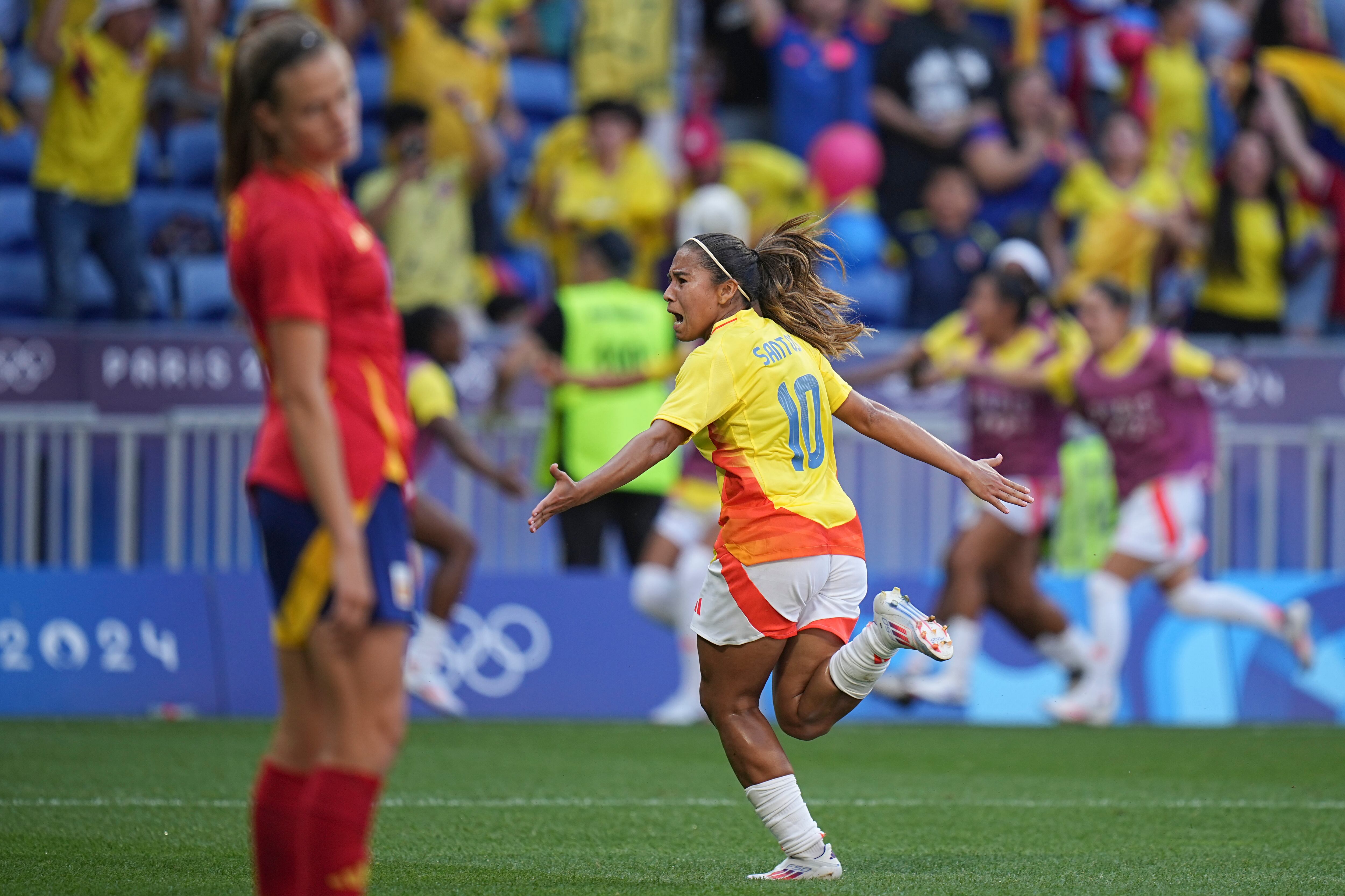 Colombia's Leicy Santos celebrates after scoring her side's 2nd goal during the women's quarter-final soccer match between Spain and Colombia, at Lyon Stadium, during the 2024 Summer Olympics, Saturday, Aug. 3, 2024, in Decines, France. (AP Photo/Laurent Cipriani)