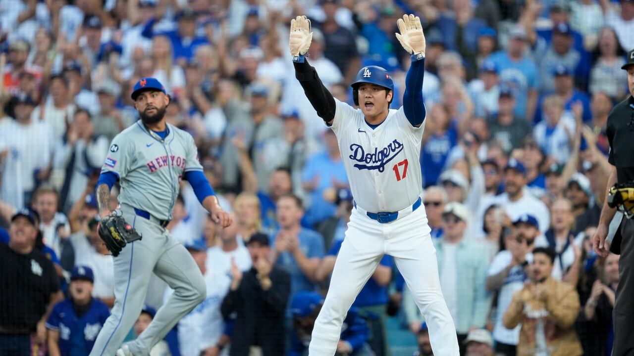 Shohei OhtanLos Angeles Dodgers' Shohei Ohtani celebrates after scoring on a double by Tommy Edman during the first inning in Game 6 of a baseball NL Championship Series against the New York Mets, Sunday, Oct. 20, 2024, in Los Angeles. (AP Photo/Ashley Landis)i