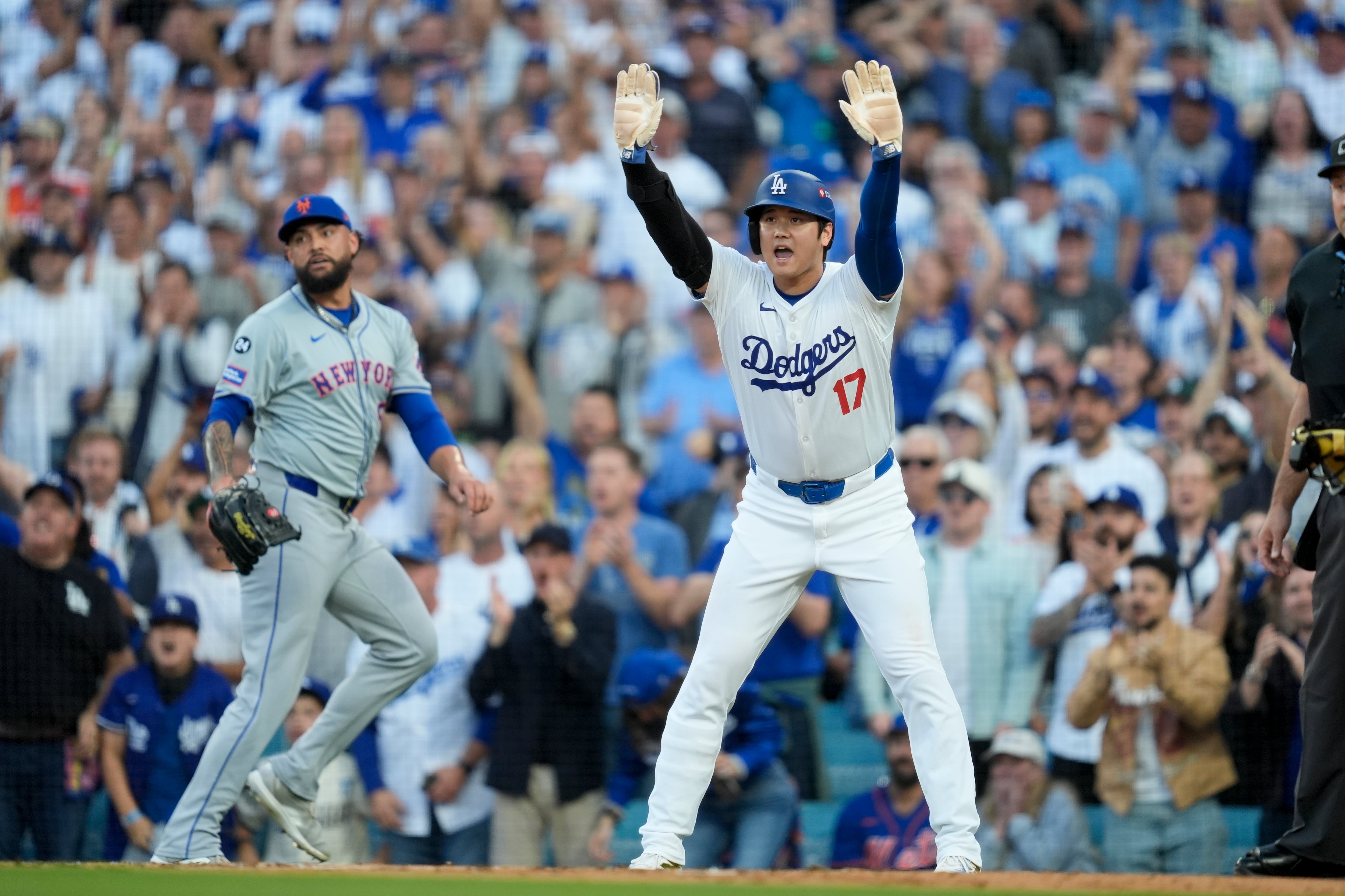 Shohei OhtanLos Angeles Dodgers' Shohei Ohtani celebrates after scoring on a double by Tommy Edman during the first inning in Game 6 of a baseball NL Championship Series against the New York Mets, Sunday, Oct. 20, 2024, in Los Angeles. (AP Photo/Ashley Landis)i