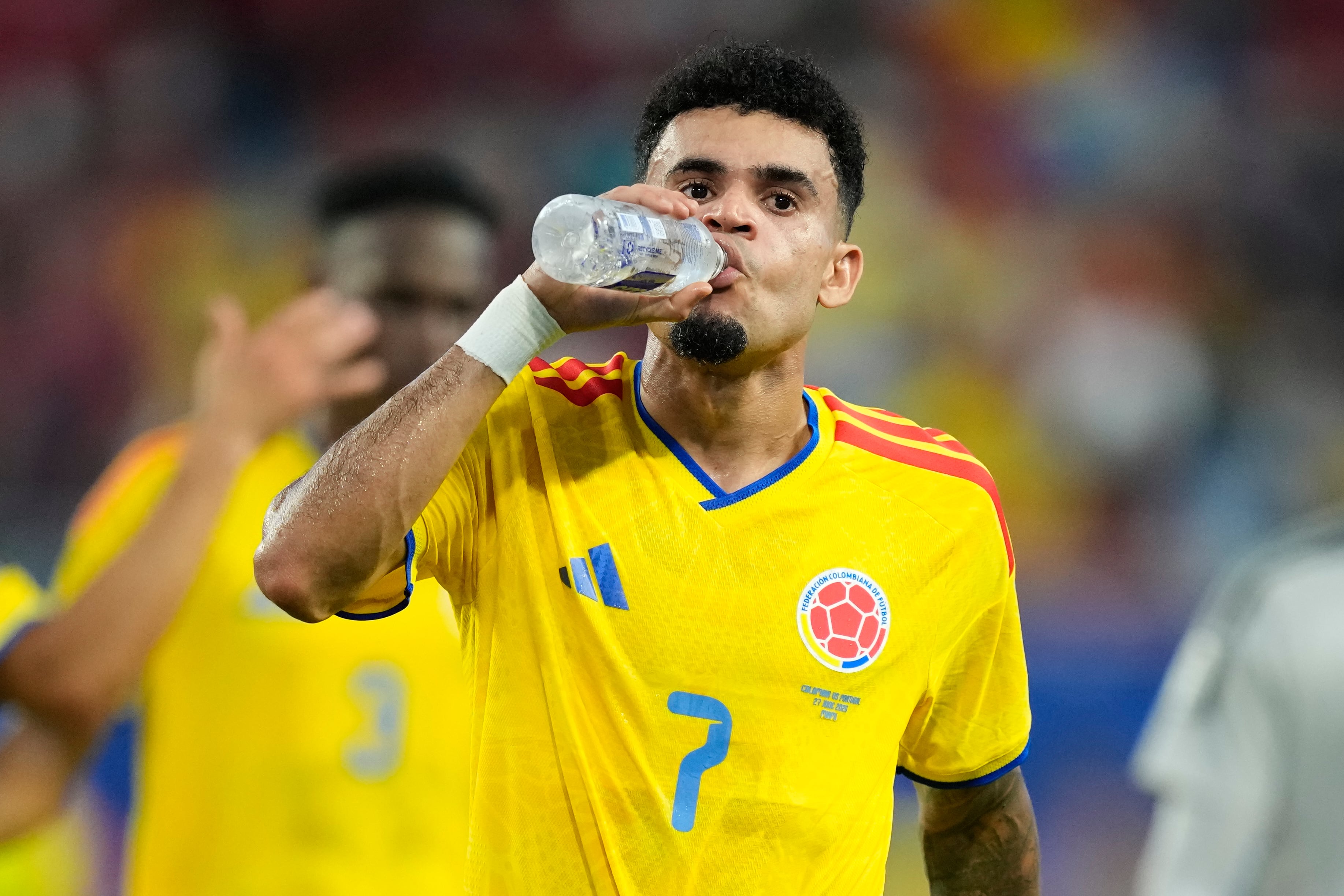 Colombia's Luis Diaz (7) takes a drink as he leaves the field at halftime during the World Cup Group K soccer match between Colombia and Portugal in Miami Gardens, Fla., Saturday, June 27, 2026. (AP Photo/Rebecca Blackwell)