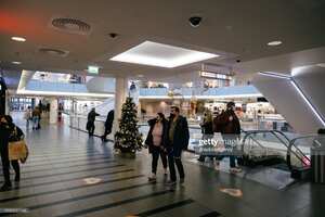 HELSINKI, FINLAND - DECEMBER 20: People wearing protective face masks are seen inside Forum shopping center in Helsinki, Finland on December 20, 2020. In Finland the latest restrictions have limited the opening time of restaurants and bars, and closed most of the public sport and cultural facilities. (Photo by Alessandro Rampazzo/Anadolu Agency via Getty Images)