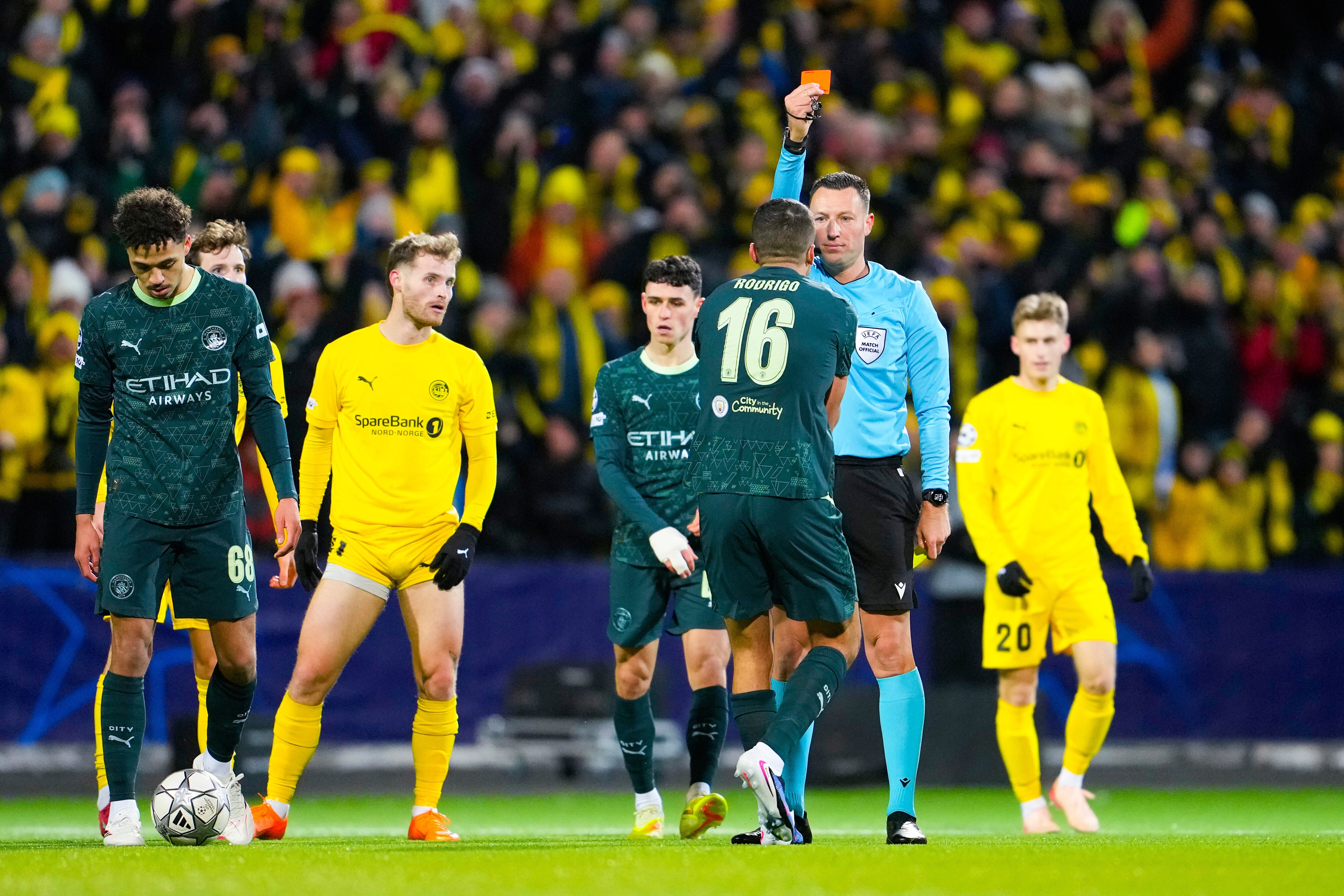 Manchester City's Rodri is shown a red card by referee Sven Jablonski during the Champions League soccer match between Bodo/Glimt and Manchester City in Bodo, Norway, Tuesday, Jan. 20, 2026. (Fredrik Varfjell/NTB via AP)