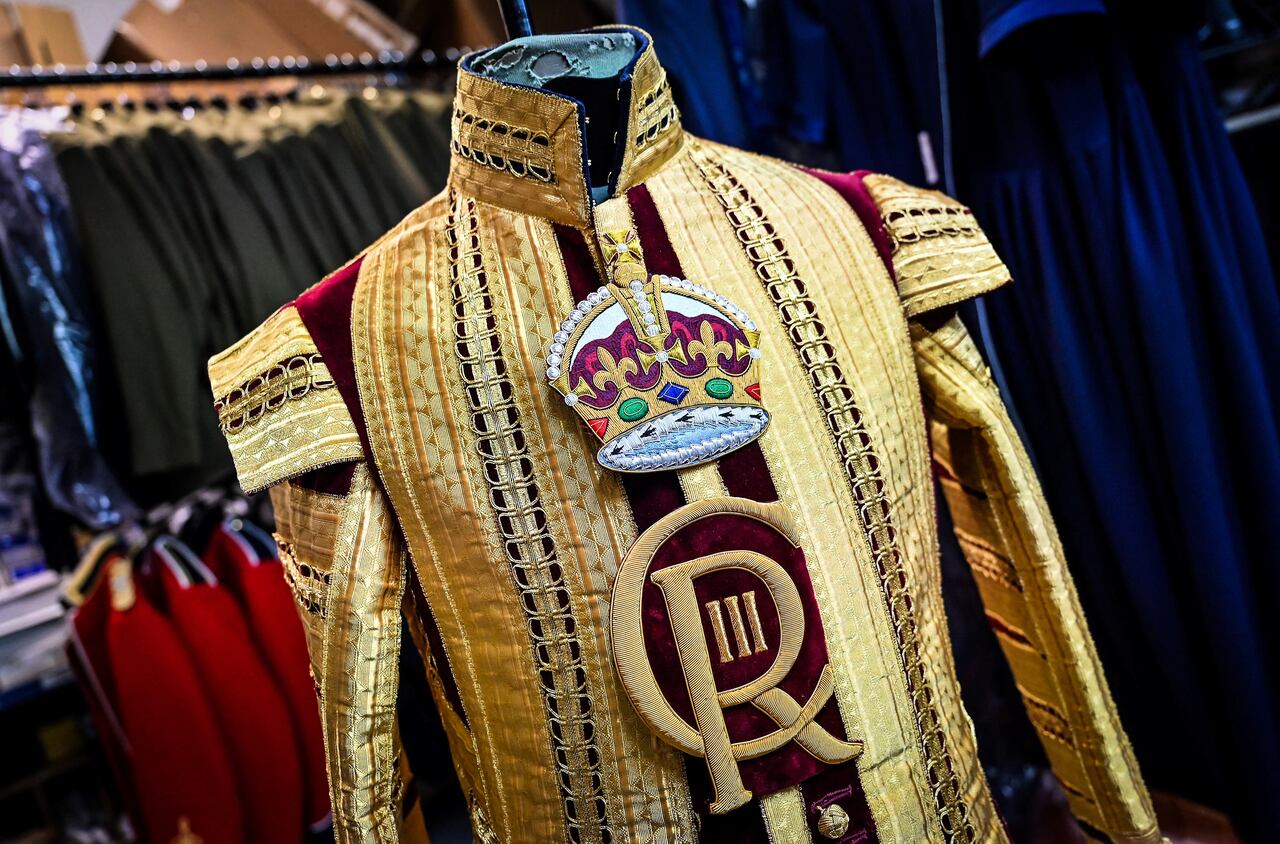 A Drum Major's State coat adorned with the new CR III cypher and to be worn during the Coronation of Britain's King Charles III and his wife Britain's Camilla, Queen Consort is pictured at Kashket & Partners atelier, in north London, on May 5, 2023. (Photo by Justin TALLIS / AFP)