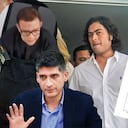 Nicolas Petro (C), son of Colombian President Gustavo Petro, accompanied by his girlfriend, Laura Ojeda (covered), arrives for a hearing at the Supreme Court of Justice in Barranquilla, Colombia, on March 14, 2024. Nicolas Petro was arrested on July 29, 2023, on charges of money laundering and illicit enrichment in a scandal linked to his father's election campaign. He is currently on parole. (Photo by Jesus RICO / AFP)