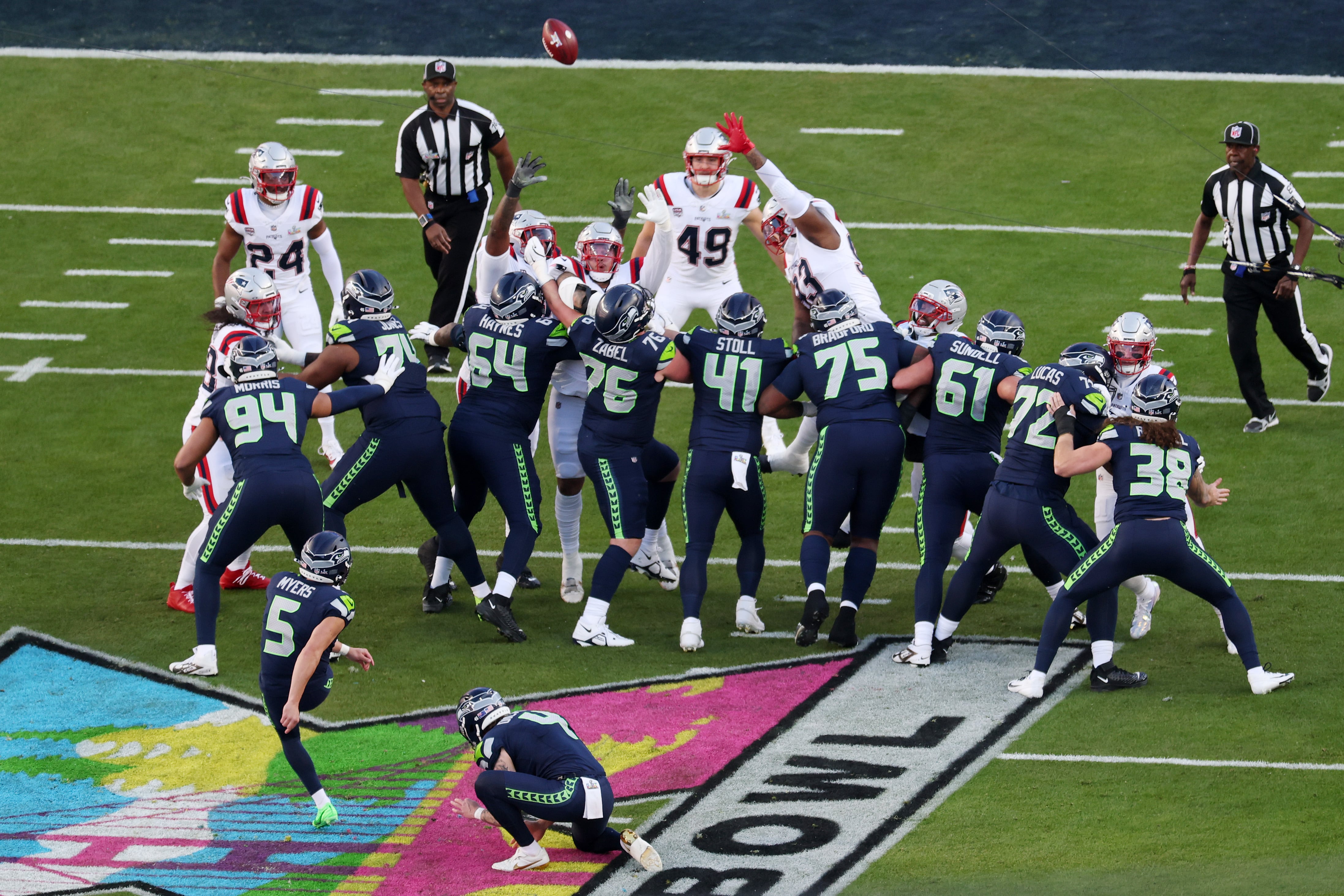 SANTA CLARA, CALIFORNIA - FEBRUARY 08: Drake Maye #10 of the New England Patriots throws under pressure from Devon Witherspoon #21 of the Seattle Seahawks during the first quarter in Super Bowl LX at Levi's Stadium on February 08, 2026 in Santa Clara, California. (Photo by Ishika Samant/Getty Images)