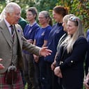 Britain's King Charles III, and Queen Camilla, meet estate staff as they leave Crathie Parish Church, after a church service, to mark the first anniversary of the death of Queen Elizabeth II, near Balmoral, Scotland, Friday, Sept. 8, 2023. (Andrew Milligan/Pool Photo via AP)