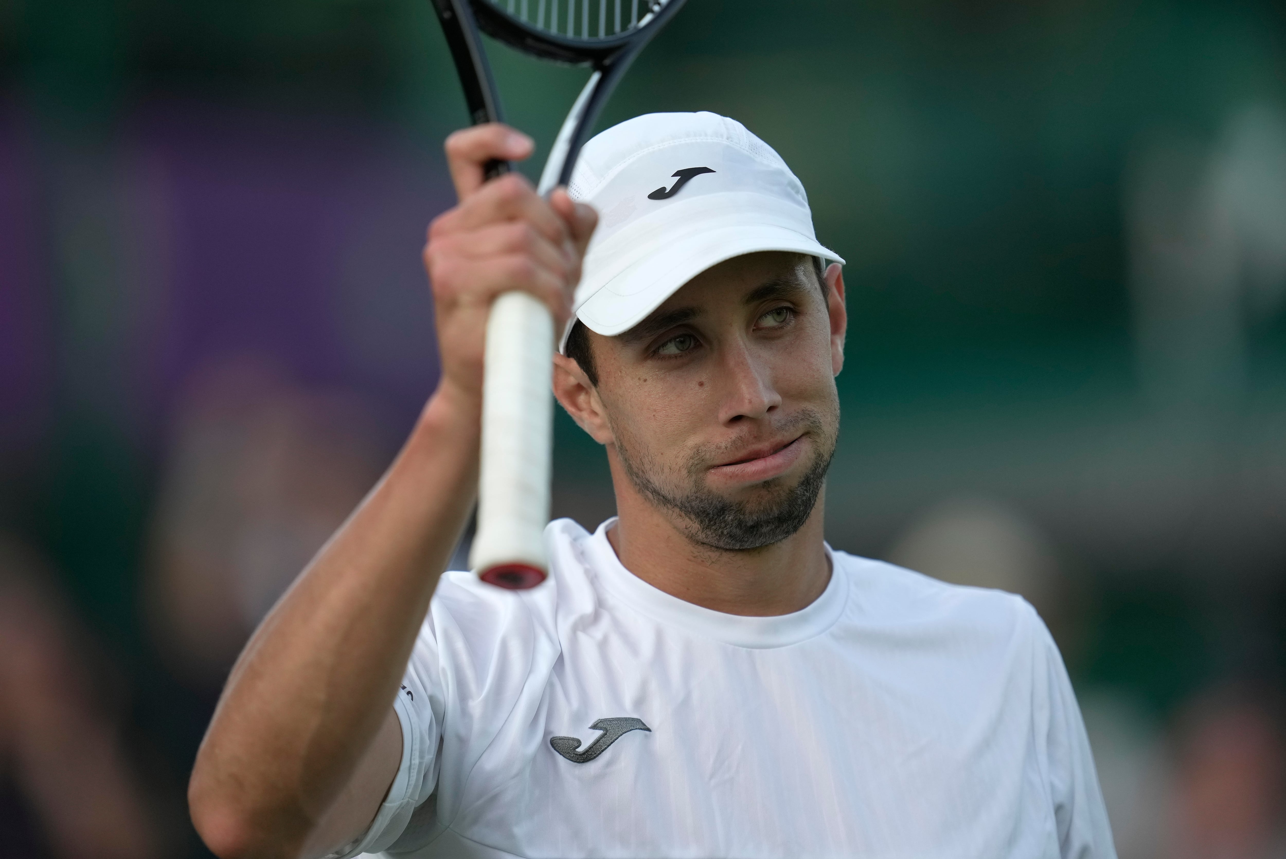 Colombia's Daniel Elahi Galan reacts after beating Sweden's Mikael Ymer in a men's singles match on day five of the Wimbledon tennis championships in London, Friday, July 7, 2023. (AP Photo/Kin Cheung)