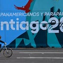 SANTIAGO, CHILE - OCTOBER 18: A cyclist passes by a mural that promotes the Pan Am Games at Baquedano Square on October 18, 2023 in Santiago, Chile. Santiago prepares to host the Pan American Games which kick off on Friday 20. The historic social unrest that paralyzed the country for months in 2019 was triggered by an increase in the subway fare and ended up in a referendum to change the the Pinochet era constitution. (Photo by Claudio Santana/Getty Images)