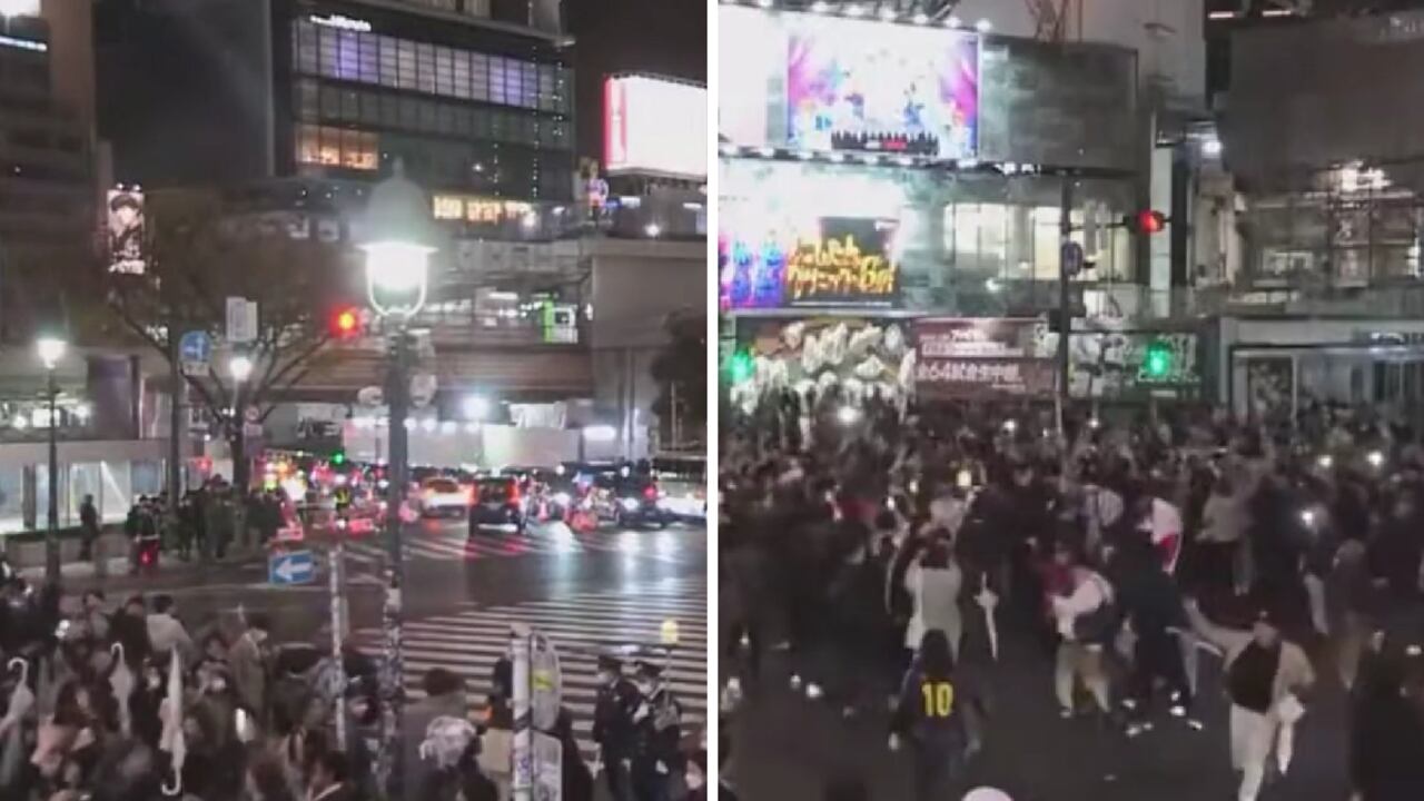Hinchas japoneses celebrando la victoria de su selección en las calles.
