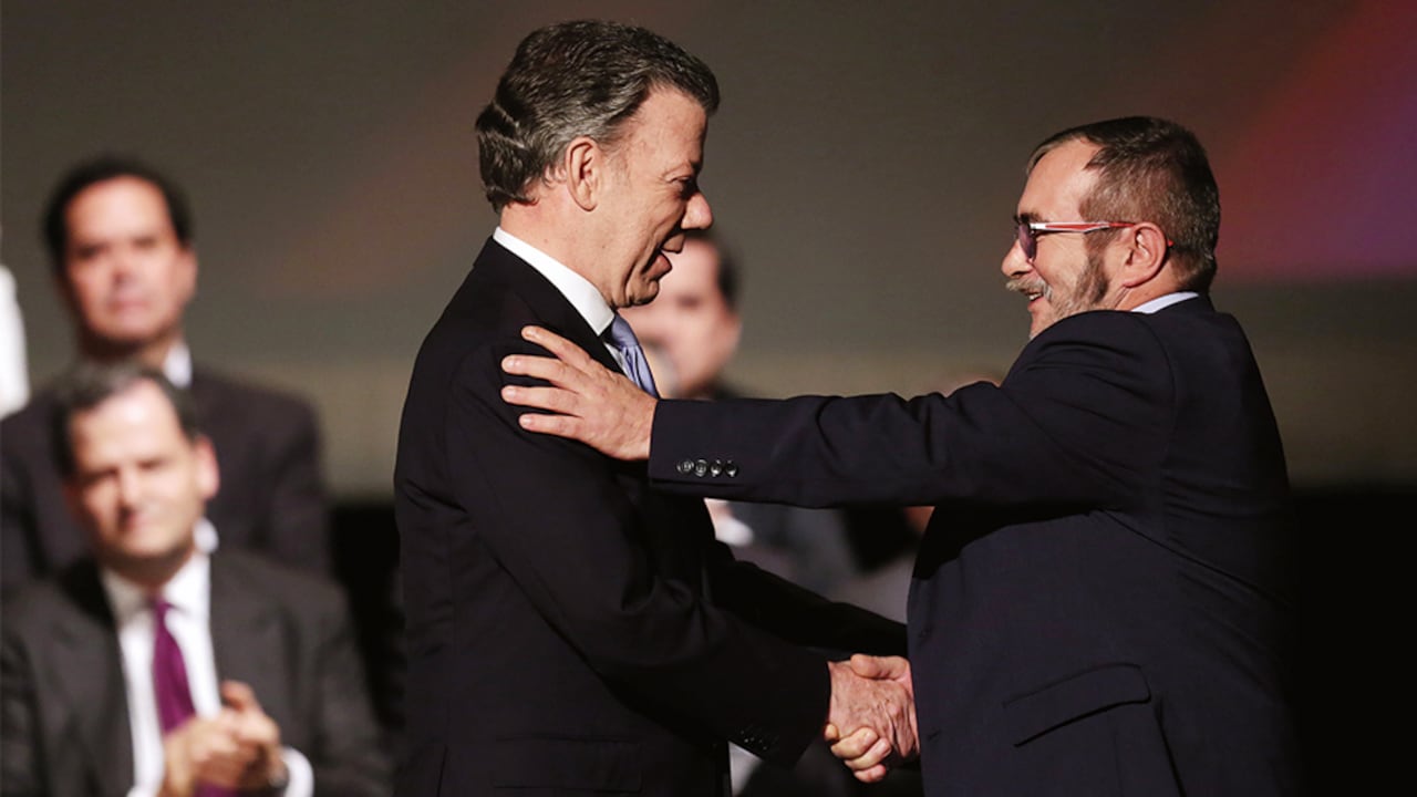 Juan Manuel Santos y Rodrigo Londoño.