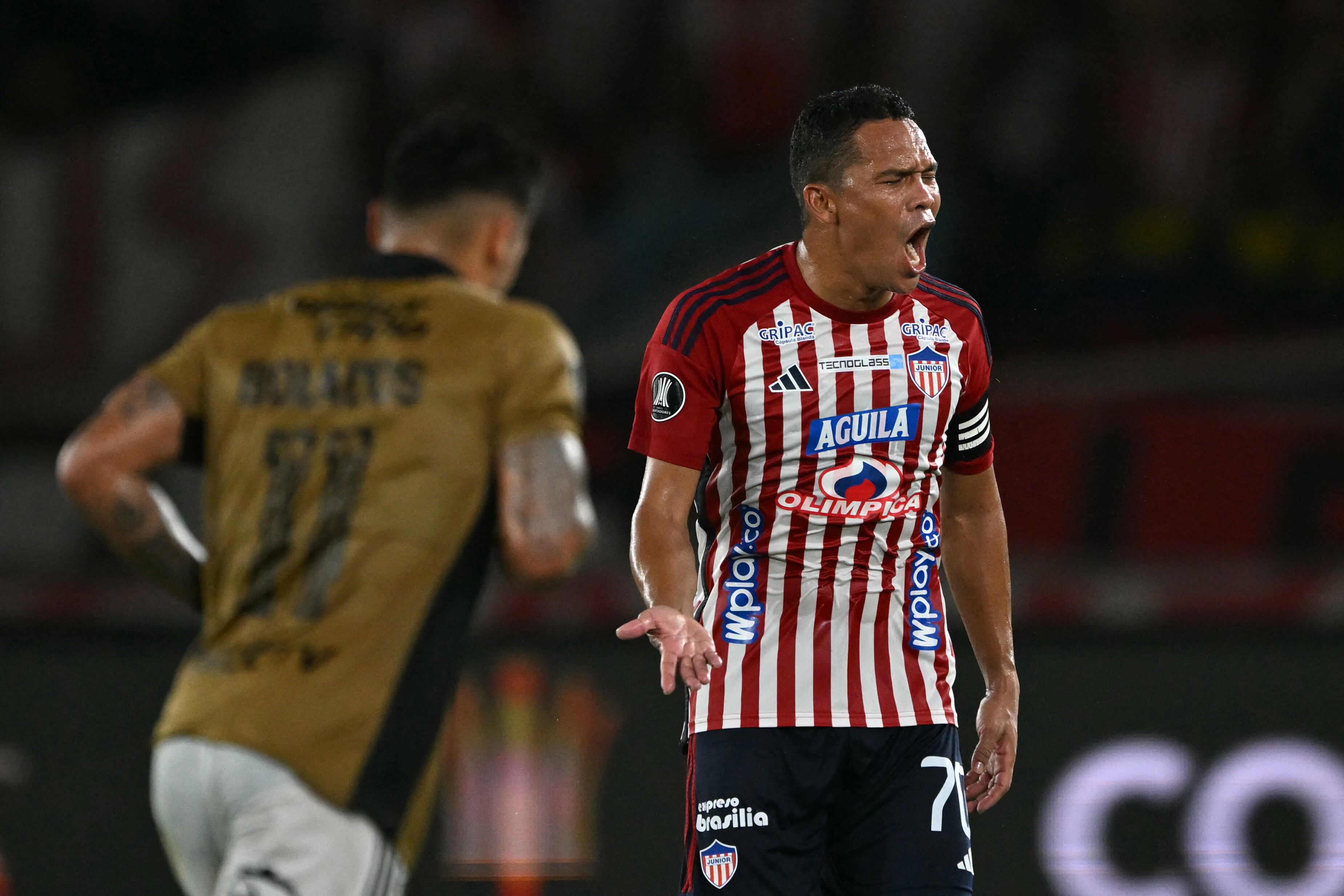 Junior's forward Carlos Bacca celebrates after scoring during the Copa Libertadores round of 16 second leg football match between Colombia's Junior and Chile's Colo Colo at the Metropolitano Roberto Melendez stadium in Barranquilla, Colombia, on August 20, 2024. (Photo by Luis ACOSTA / AFP)