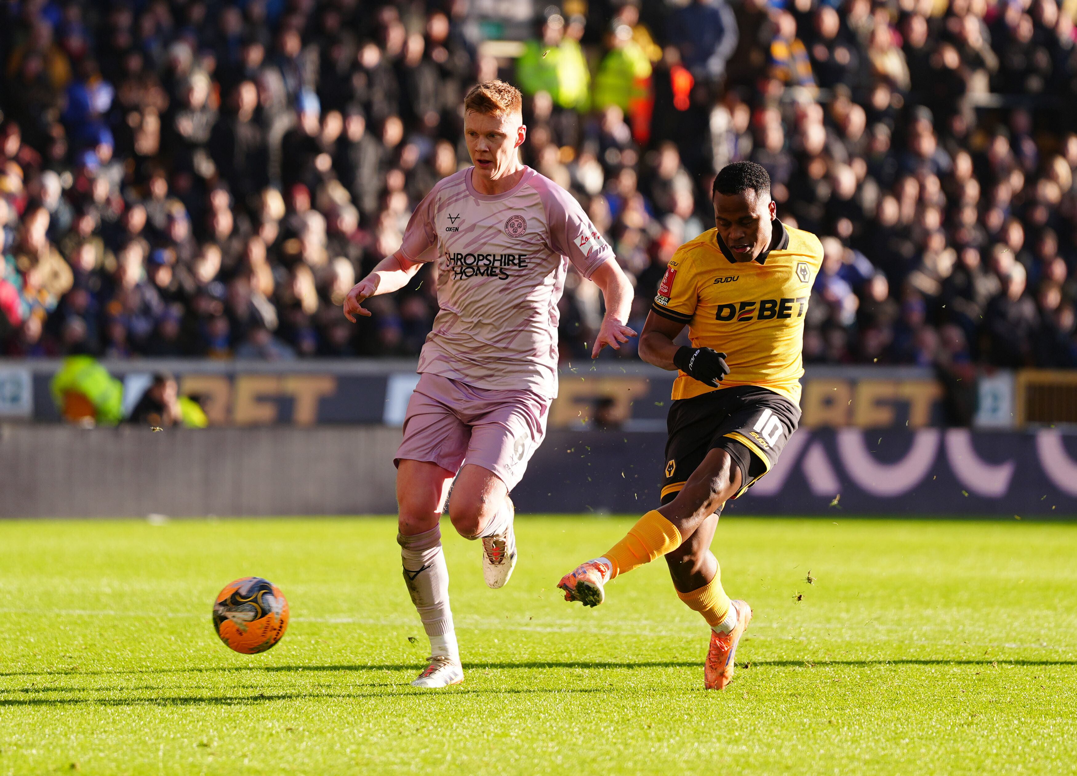 Wolverhampton Wanderers' Jhon Arias, right, scores their side's second goal of the game during the Emirates FA Cup third round match between Wolverhampton and Shrewsbury, in Wolverhampton, England, Saturday Jan. 10, 2026. (Bradley Collyer/PA via AP)