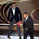 HOLLYWOOD, CA - March 27, 2022. Chris Rock and Will Smith onstage during the show at the 94th Academy Awards at the Dolby Theatre at Ovation Hollywood on Sunday, March 27, 2022. (Myung Chun / Los Angeles Times via Getty Images)