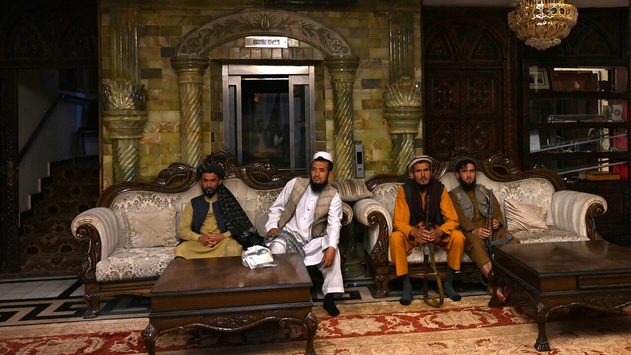 In this picture taken on September 11, 2021, a member of the Taliban visits the greenhouse yard at the home of the Afghan warlord Abdul Rashid Dostum in the Sherpur neighborhood of Kabul. - Taliban fighters have taken over the glitzy Kabul mansion of one of their fiercest enemies -- the warlord and fugitive ex-vice president Dostum. (Photo by Wakil KOHSAR / AFP) / TO GO WITH 'Afghanistan-Conflict-Dostum', SCENE by Emmanuel DUPARCQ