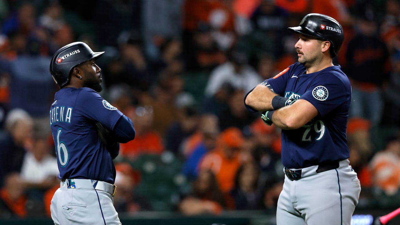 DETROIT, MICHIGAN - OCTOBER 07: Cal Raleigh #29 of the Seattle Mariners celebrates with Randy Arozarena #56 after hitting a two-run home run against the Detroit Tigers during the ninth inning in game three of the American League Division Series at Comerica Park on October 07, 2025 in Detroit, Michigan. (Photo by Duane Burleson/Getty Images)