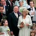 FILE - Britain's Camilla, the Duchess of Cornwall, center, stands beside her husband Prince Charles, right, her former husband Andrew Parker Bowles, center left, and her son Tom, top right, as they leave St Cyriac's Church, after the wedding her daughter Laura Parker Bowles and Harry Lopes in Lacock, Wiltshire, England, Saturday May 6, 2006. (AP Photo/Matt Dunham, File)