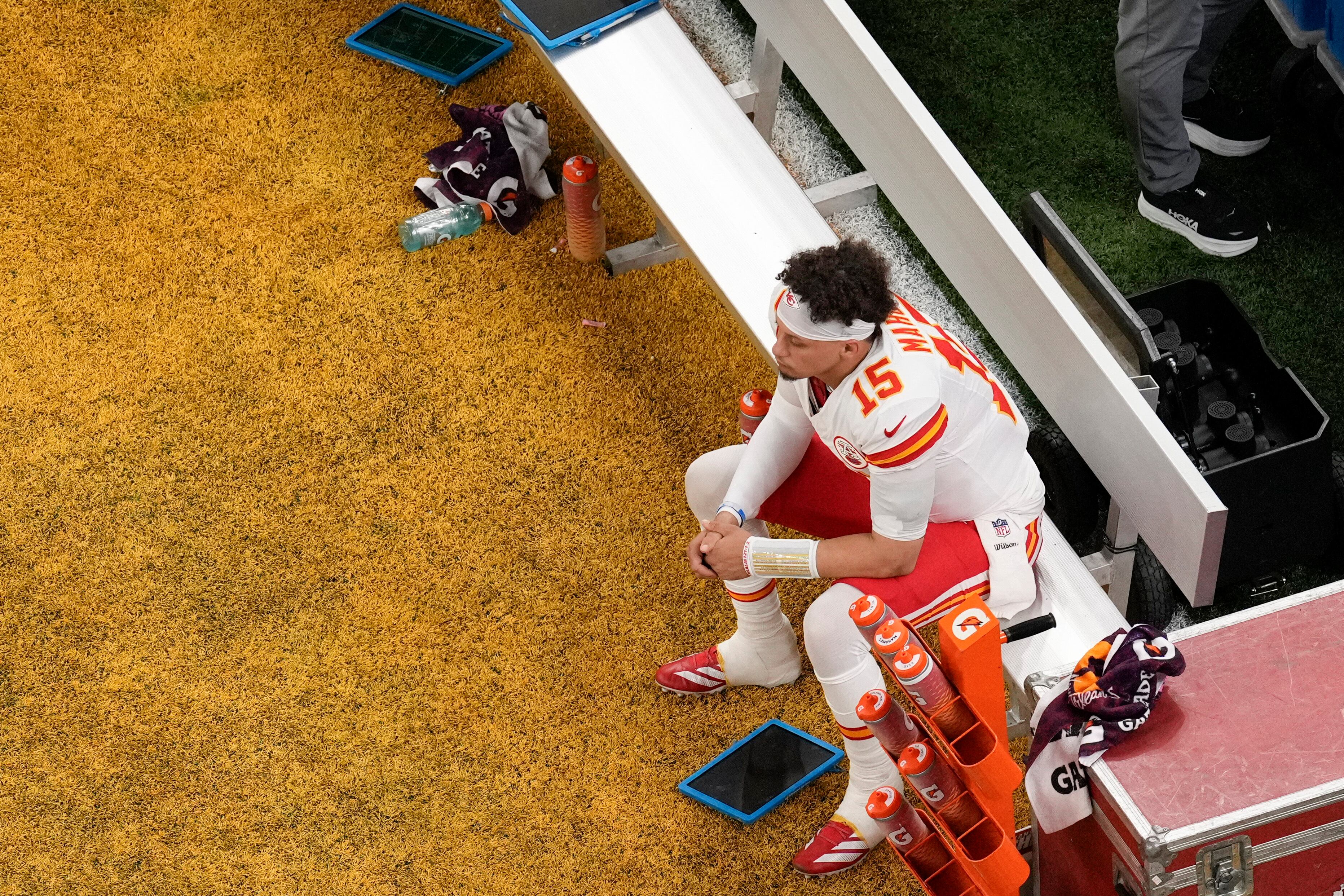 Kansas City Chiefs quarterback Patrick Mahomes (15) sits on the bench during the first half of the NFL Super Bowl 59 football game against the Philadelphia Eagles, Sunday, Feb. 9, 2025, in New Orleans. (AP Photo/David J. Phillip)