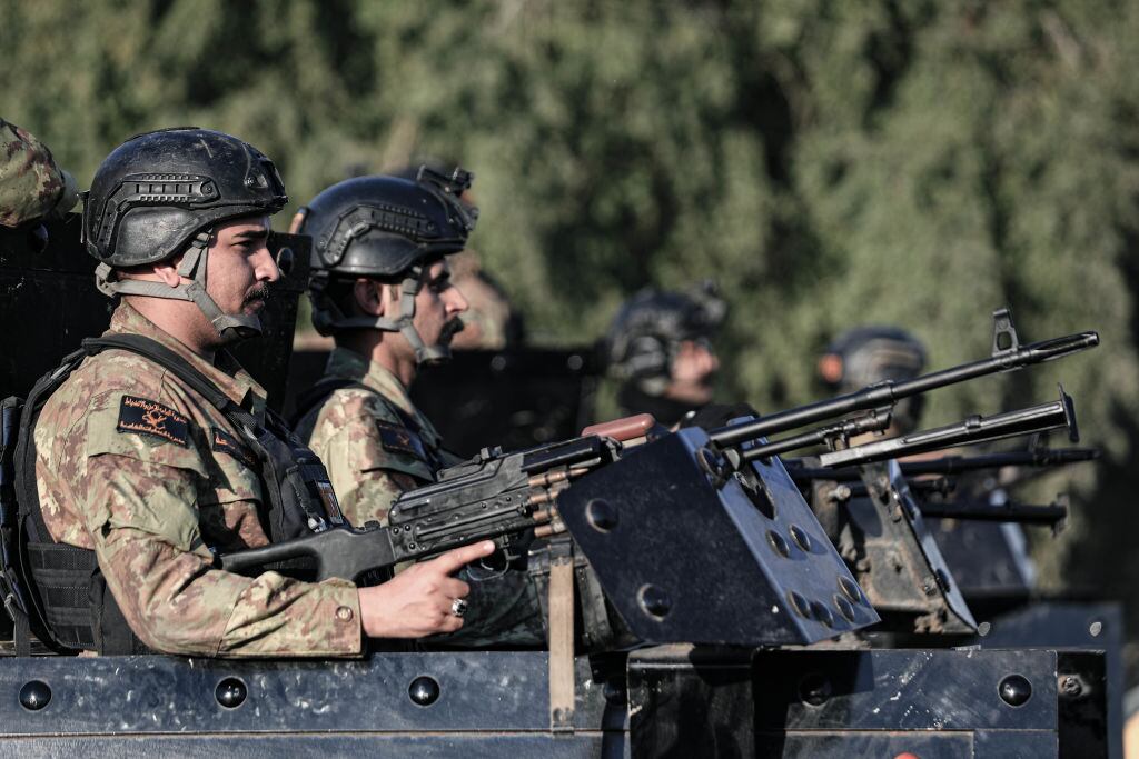 08 February 2024, Iraq, Baghdad: Iraqi army soldiers secure the funeral of Abu Baqir al-Saadi, a senior commander in Kataib Hezbollah who was killed with two others when their vehicle was hit by a US drone strike in Baghdad on Wednesday. Photo: Ameer Al-Mohammedawi/dpa (Photo by Ameer Al-Mohammedawi/picture alliance via Getty Images)