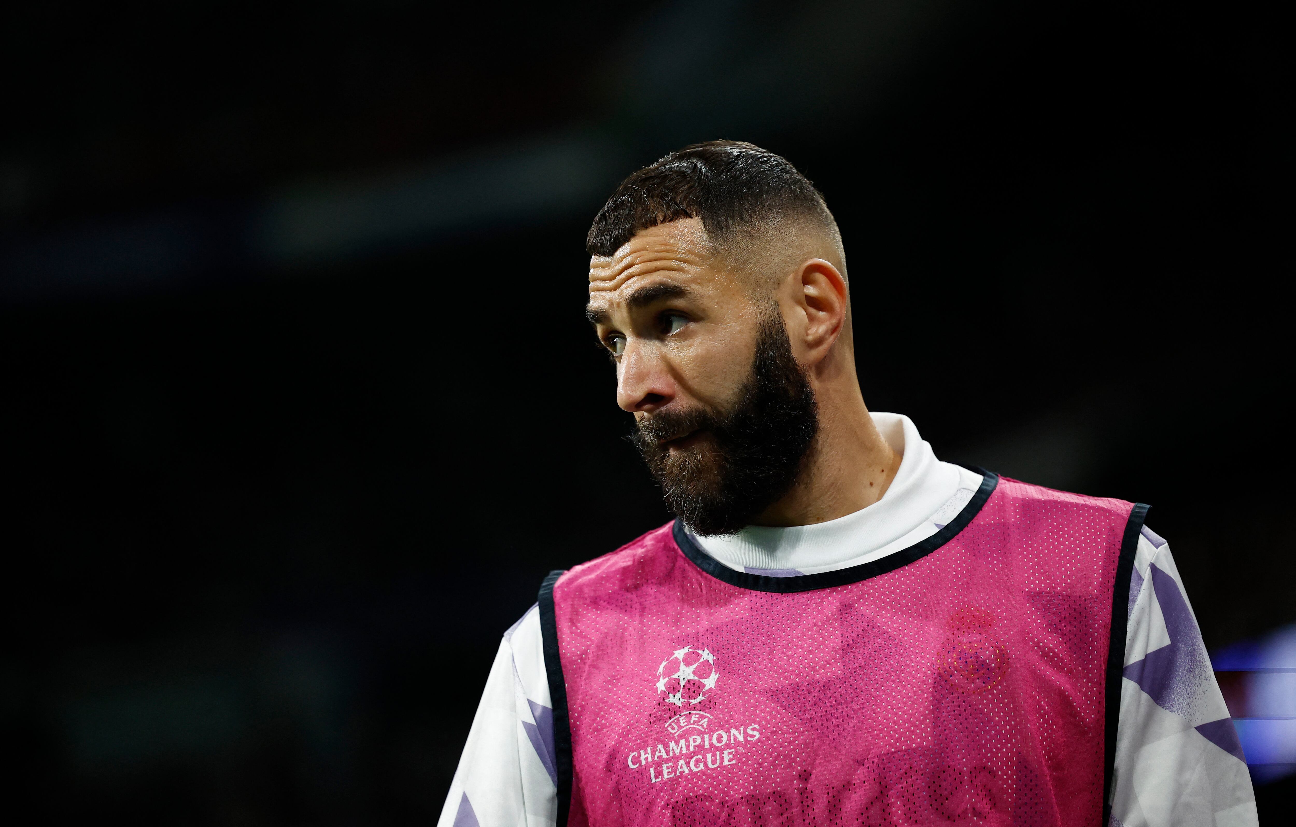 Soccer Football - Champions League - Group F - Real Madrid v Celtic - Santiago Bernabeu, Madrid, Spain - November 2, 2022 Real Madrid's Karim Benzema warms up from the substitutes bench REUTERS/Juan Medina