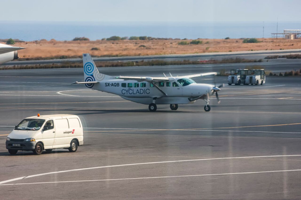 Cessna 208B Grand Caravan aircraft of Cycladic Air spotted at Heraklion International Airport Nikos Kazantzakis in Crete island. Cycladic is a small new airline serving direct passenger flights between the Aegean islands. The airline carrier offers inter-island cost-effective service and affordable luxury island hopping in the Greek islands, operated by iFLY Aviation Services. The airplane type used is Cessna Grand Caravan EX with the ability to carry 8 to 12 passengers. The single-engine turboprop propeller plane is a strutted high-wing Cessna 208 Caravan with fixed tricycle landing gear, the specific has the registration tail number SX-AQB. Heraklion, Crete, Greece on October 2023 (Photo by Nicolas Economou/NurPhoto via Getty Images)