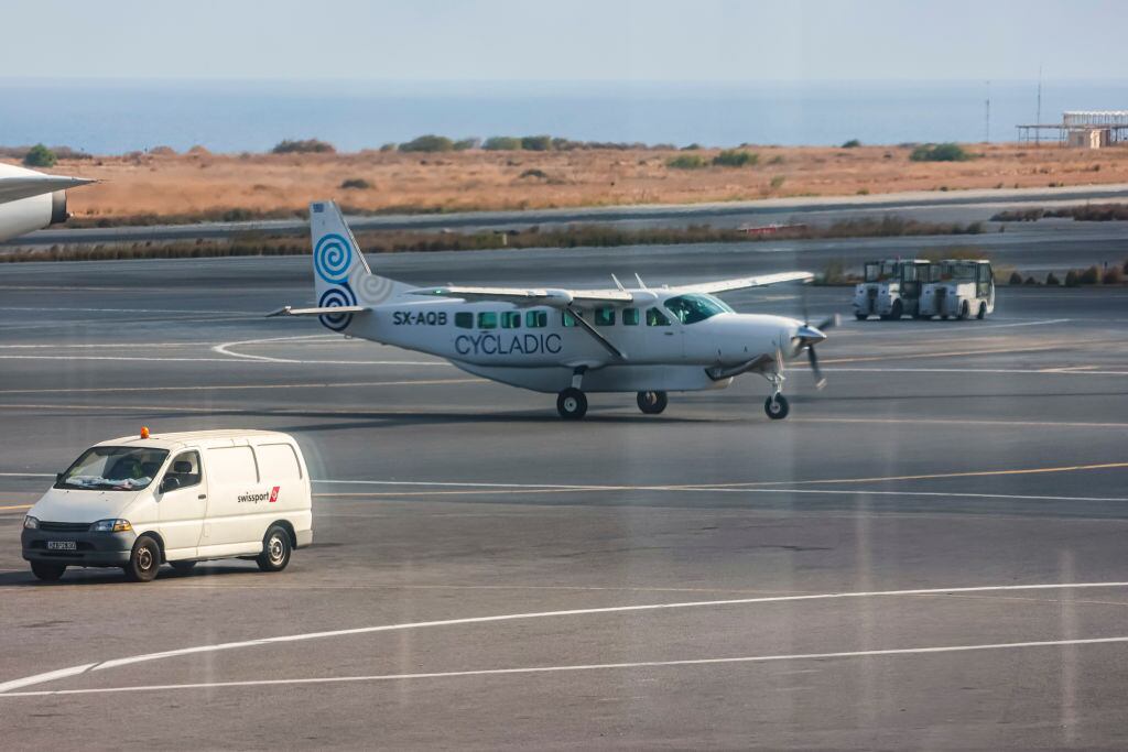 Cessna 208B Grand Caravan aircraft of Cycladic Air spotted at Heraklion International Airport Nikos Kazantzakis in Crete island. Cycladic is a small new airline serving direct passenger flights between the Aegean islands. The airline carrier offers inter-island cost-effective service and affordable luxury island hopping in the Greek islands, operated by iFLY Aviation Services. The airplane type used is Cessna Grand Caravan EX with the ability to carry 8 to 12 passengers. The single-engine turboprop propeller plane is a strutted high-wing Cessna 208 Caravan with fixed tricycle landing gear, the specific has the registration tail number SX-AQB. Heraklion, Crete, Greece on October 2023 (Photo by Nicolas Economou/NurPhoto via Getty Images)