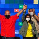 Diosdado Cabello, from The United Socialist Party of Venezuela (PSUV) and Great Patriotic Pole Alliance, left, raises his arm with Venezuela's Vice President Delcy Rodriguez as they celebrate their party's victory in the country's parliamentary elections in Caracas, Venezuela, Monday, Dec. 7, 2020. (AP Photo/Ariana Cubillos)