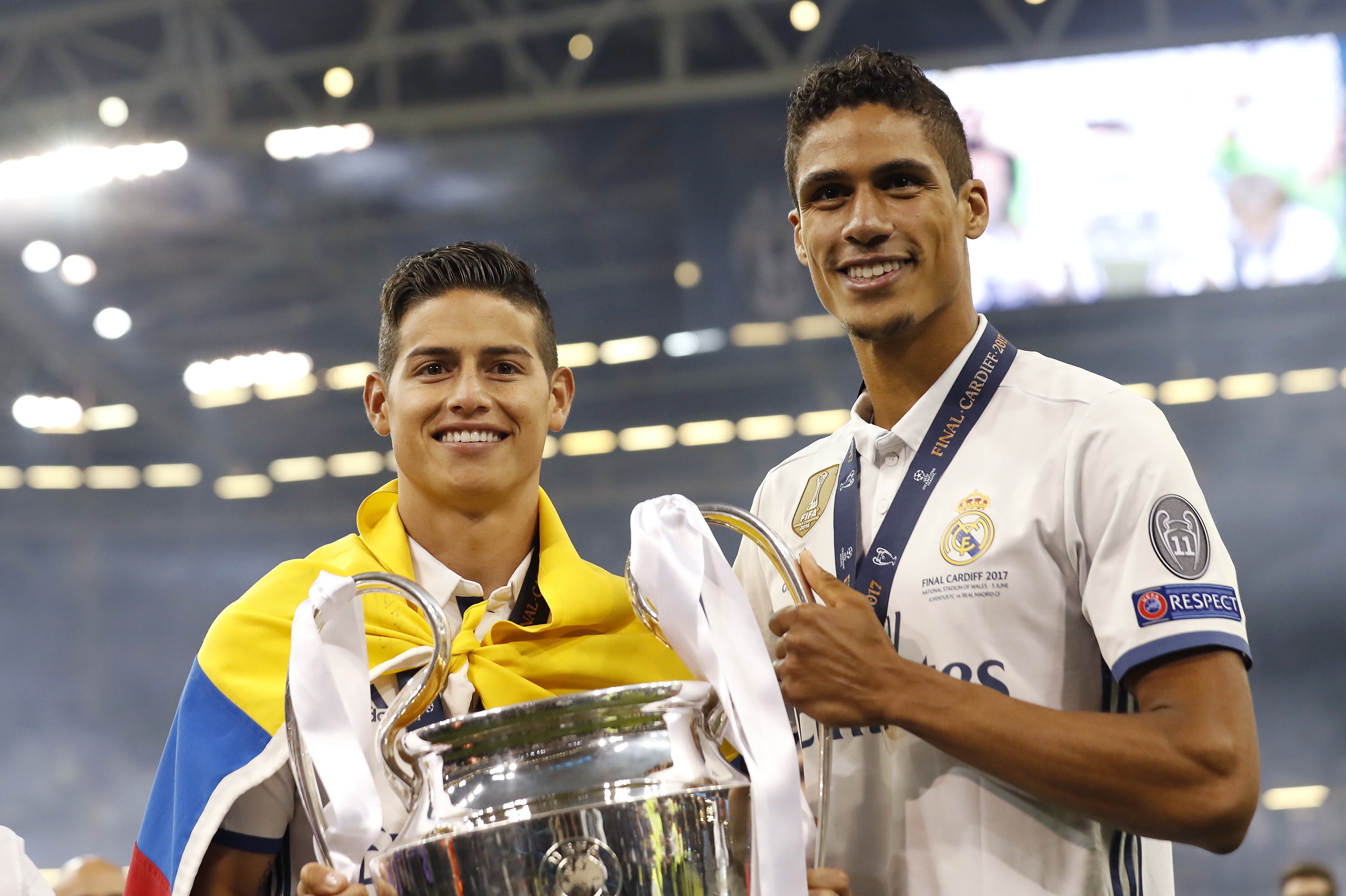 (L-R) James Rodriguez of Real Madrid, Raphael Varane of Real Madrid with Champions League trophy, Coupe des clubs Champions Europeeensduring the UEFA Champions League final match between Juventus FC and Real Madrid on June 3, 2017 at the Millennium Stadium in Cardiff, Wales(Photo by VI Images via Getty Images)