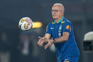 Brazil's coach Dorival Junior catches the ball during a qualifying soccer match against Paraguay for the FIFA World Cup 2026 at the Defensores del Chaco Stadium, in Asuncion, Paraguay, Tuesday, Sept.10, 2024. (AP Photo/Jorge Saenz)