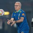 Brazil's coach Dorival Junior catches the ball during a qualifying soccer match against Paraguay for the FIFA World Cup 2026 at the Defensores del Chaco Stadium, in Asuncion, Paraguay, Tuesday, Sept.10, 2024. (AP Photo/Jorge Saenz)