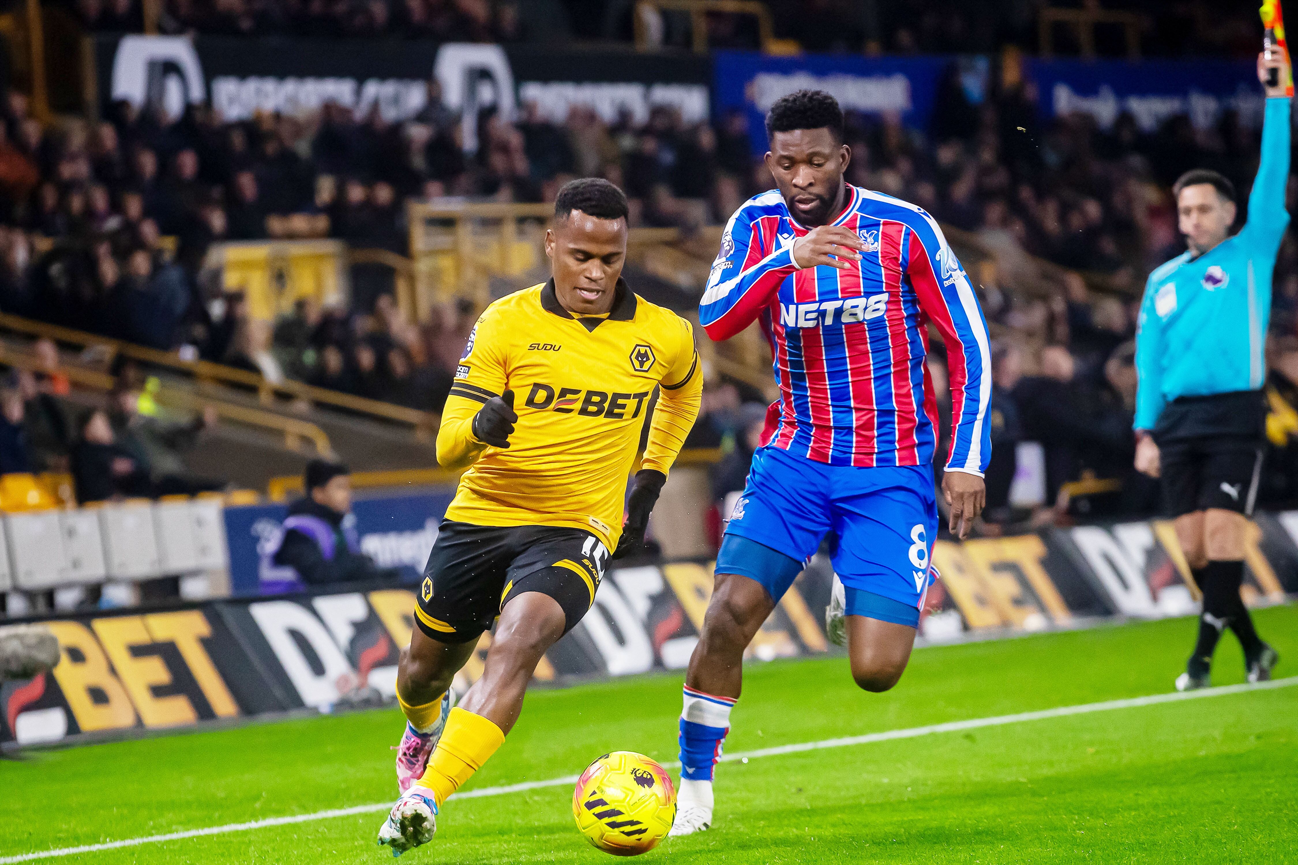 Wolverhampton Wanderers midfielder Jhon Arias (10) and Jefferson Lerma of Crystal Palace during the English championship Premier League football match between Wolverhampton Wanderers and Crystal Palace on 22 November 2025 at Molineux in Wolverhampton, England - Photo Manjit Narotra / ProSportsImages / DPPI (Photo by Manjit Narotra / ProSportsImages / DPPI via AFP)