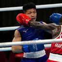 Colombia's Yuberjen Herney Martinez Rivas, right, exchanges punches with Japan's Ryomei Tanaka in their men's flyweight 52-kg quarterfinal boxing match at the 2020 Summer Olympics, Tuesday, Aug. 3, 2021, in Tokyo, Japan. (AP Photo/Themba Hadebe)