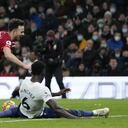 Liverpool's Diogo Jota, center, duels for the ball with Tottenham's Emerson Royal, left, and Tottenham's Davinson Sanchez during the English Premier League soccer match between Tottenham Hotspur and Liverpool at the Tottenham Hotspur Stadium in London, Sunday, Dec. 19, 2021. (AP Photo/Frank Augstein)