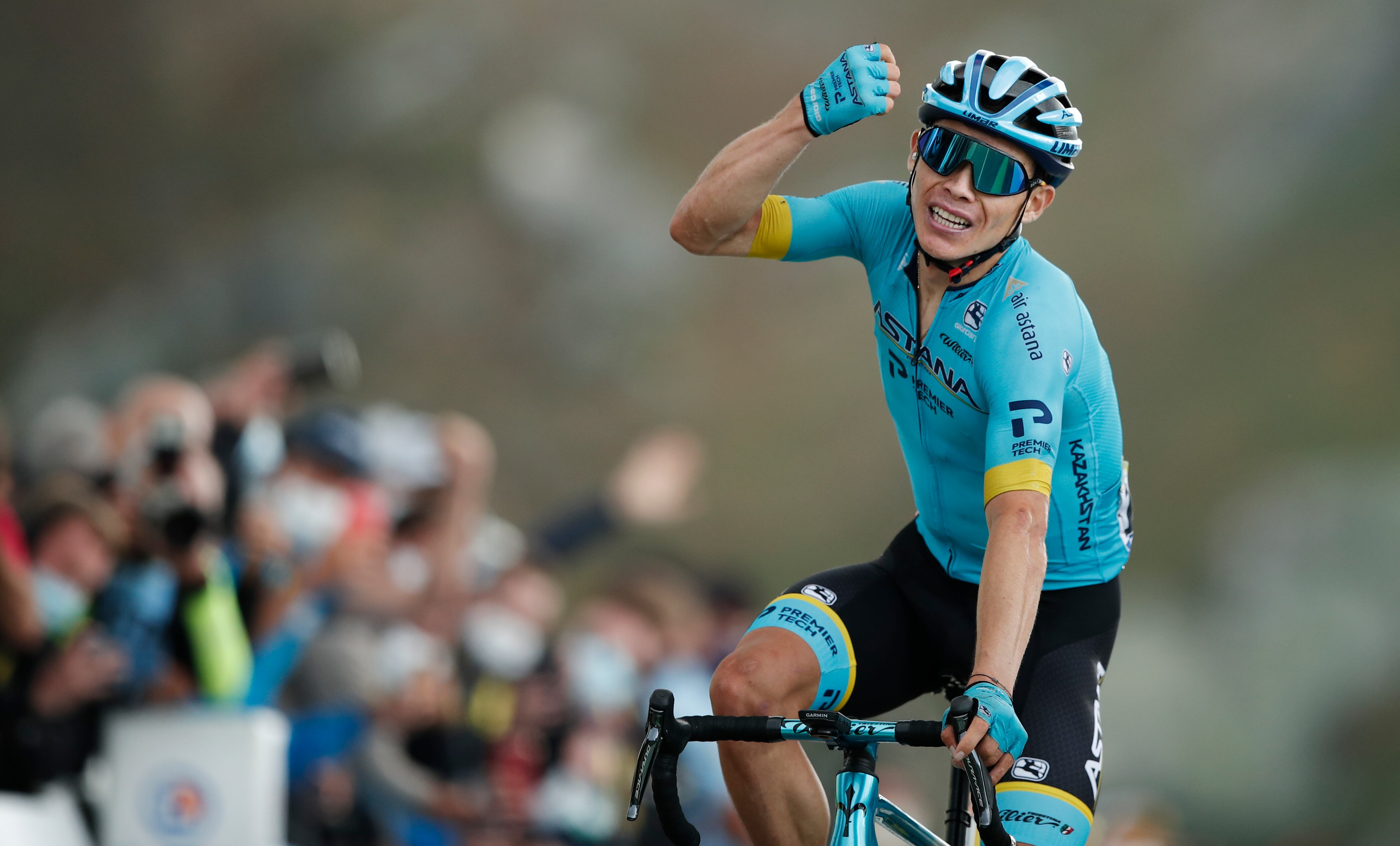 Team Astana rider Colombia's Miguel Angel Lopez celebrates as he crosses the finish line atop the Loze pass (Col de la Loze) at the end of the 17th stage of the 107th edition of the Tour de France cycling race, 170 km between Grenoble and Meribel, on September 16, 2020. (Photo by BENOIT TESSIER / POOL / AFP)
