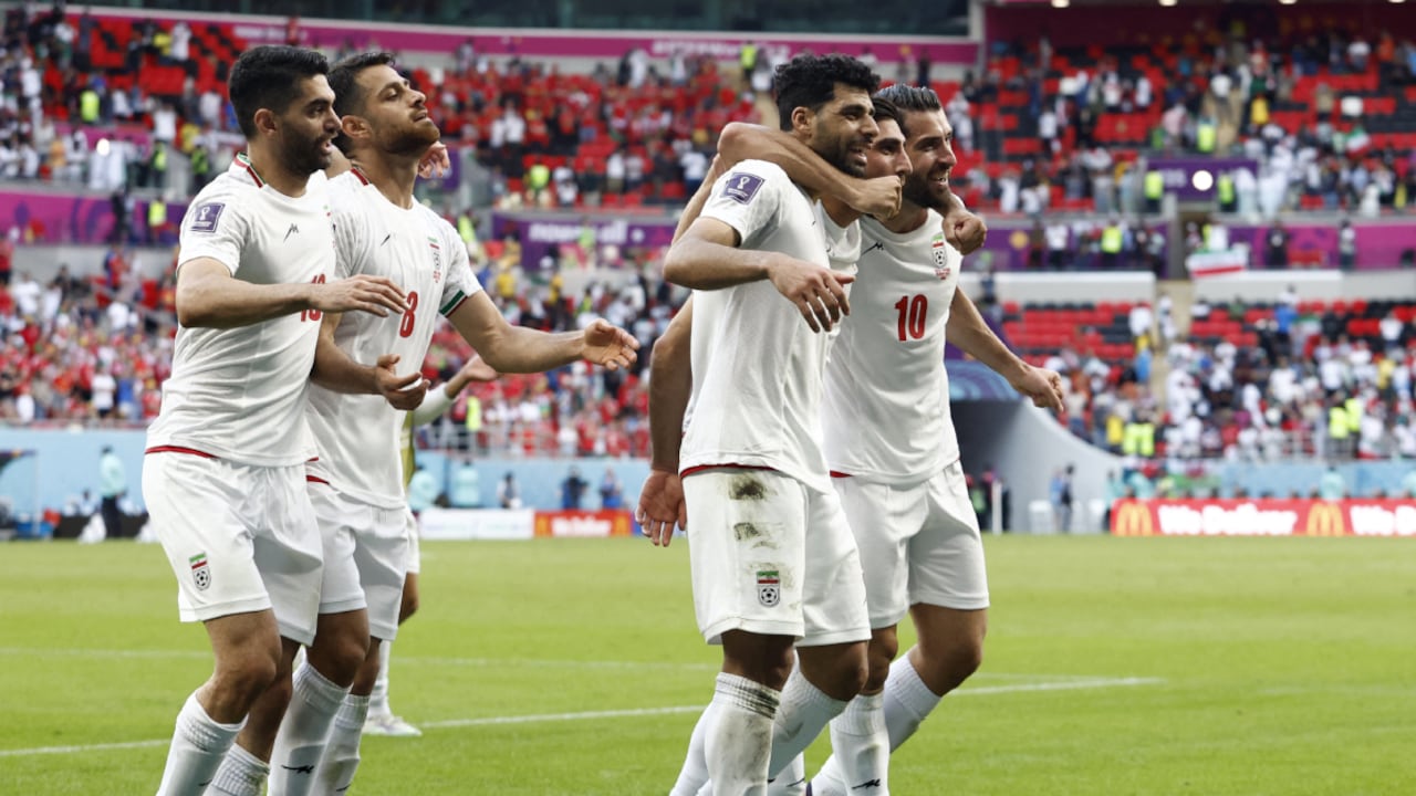 Soccer Football - FIFA World Cup Qatar 2022 - Group B - Wales v Iran - Ahmad Bin Ali Stadium, Al Rayyan, Qatar - November 25, 2022 Iran players celebrate after the match REUTERS/Amanda Perobelli