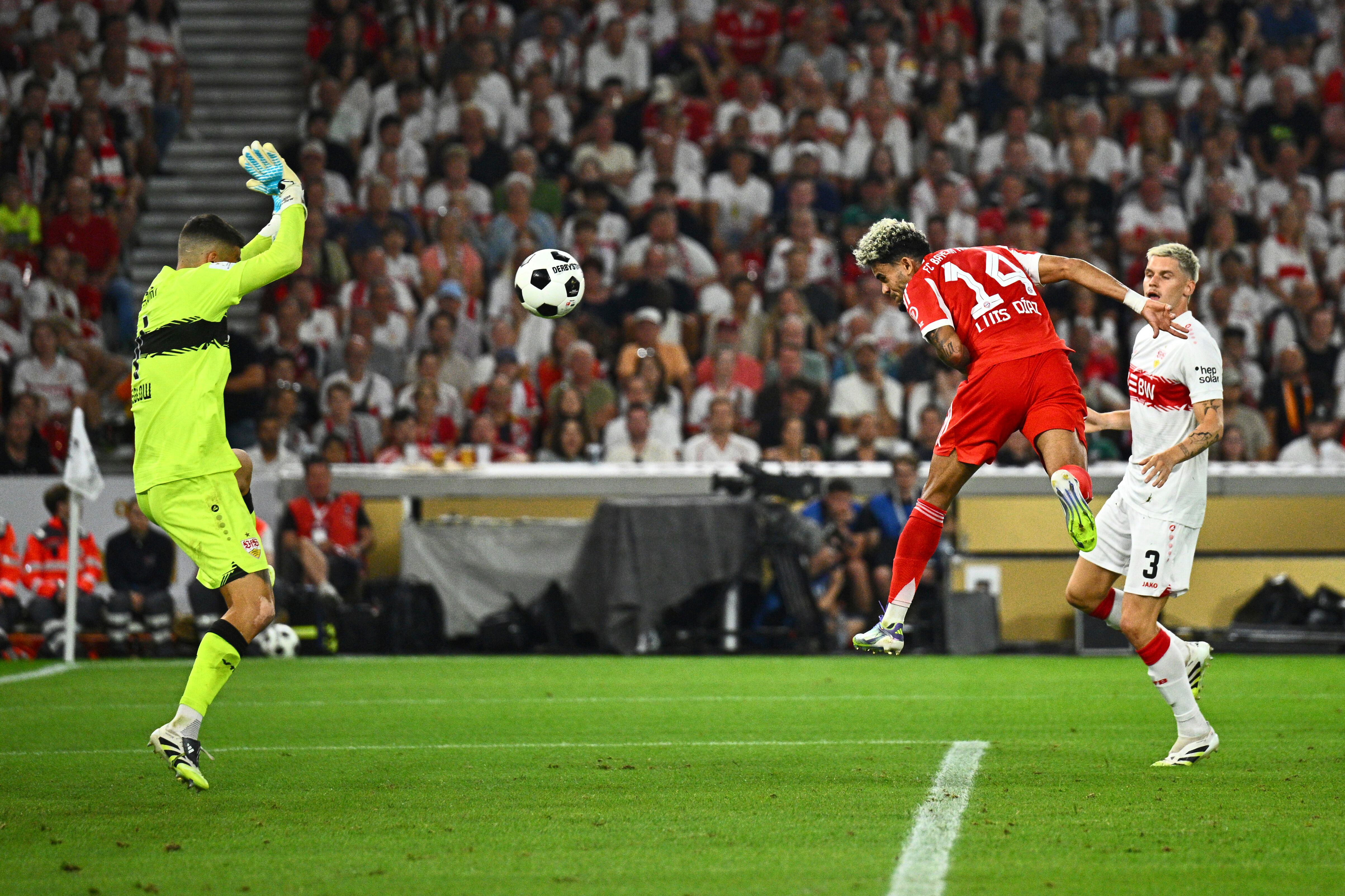 Bayern's Luis Díaz, center, celebrates scores past Stuttgart's goalkeeper Fabian Bredlow the German Supercup final soccer match between VfB Stuttgart and Bayern Munich in Stuttgart, Germany, Saturday, Aug. 16, 2025. (Tom Weller/dpa via AP)