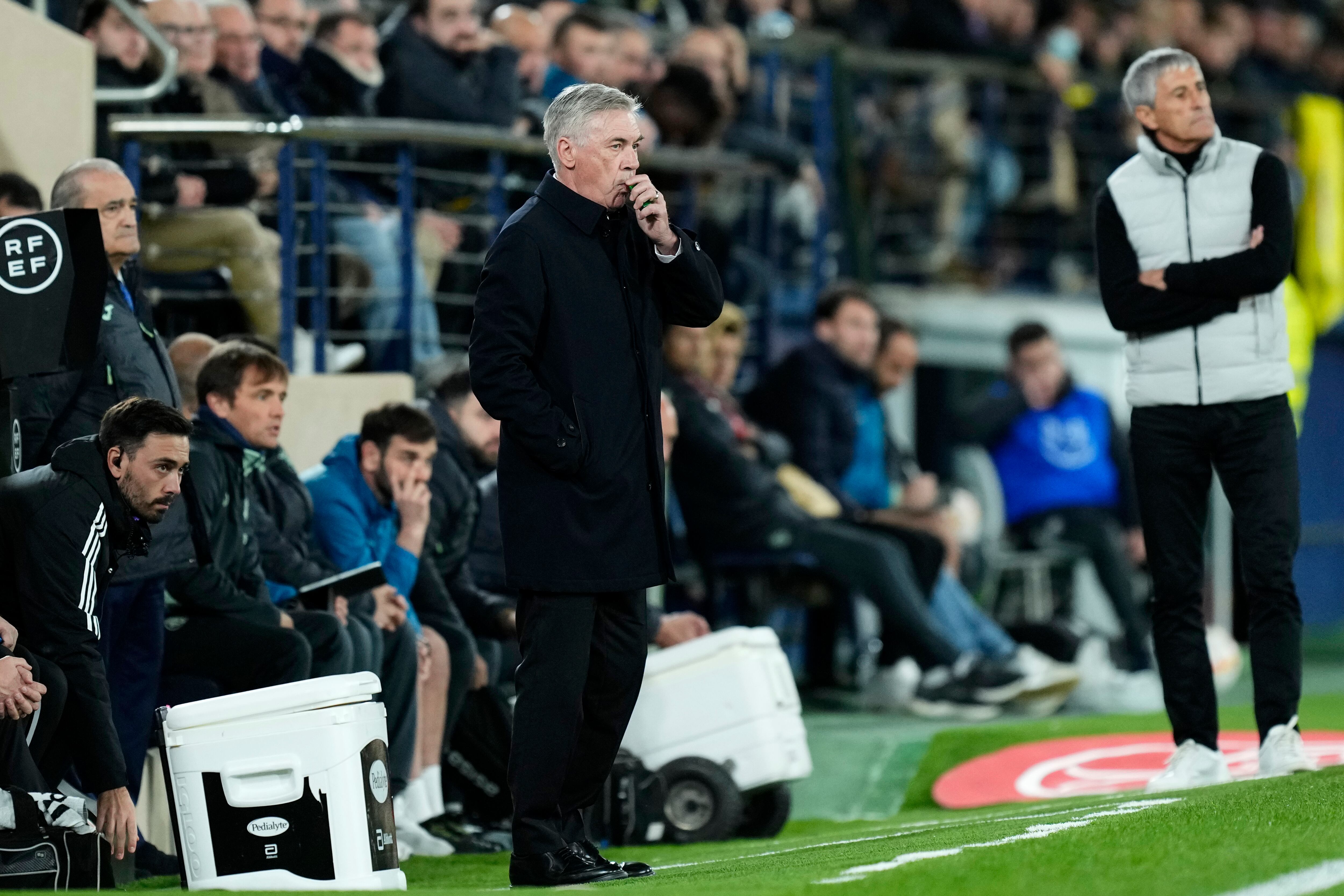 Real Madrid's head coach Carlo Ancelotti stands by the touchline during the Copa del Rey round of 16 soccer match between Villarreal CF and Real Madrid at La Ceramica stadium in Villarreal, Spain, Thursday, Jan. 19, 2023. (AP Photo/Jose Breton)