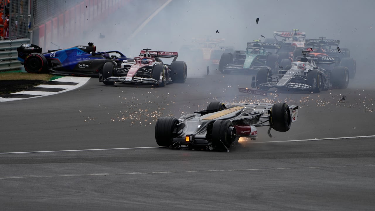 Alfa Romeo driver Guanyu Zhou of China crashes at the start of the British Formula One Grand Prix at the Silverstone circuit, in Silverstone, England, Sunday, July 3, 2022. (AP Photo/Frank Augstein)