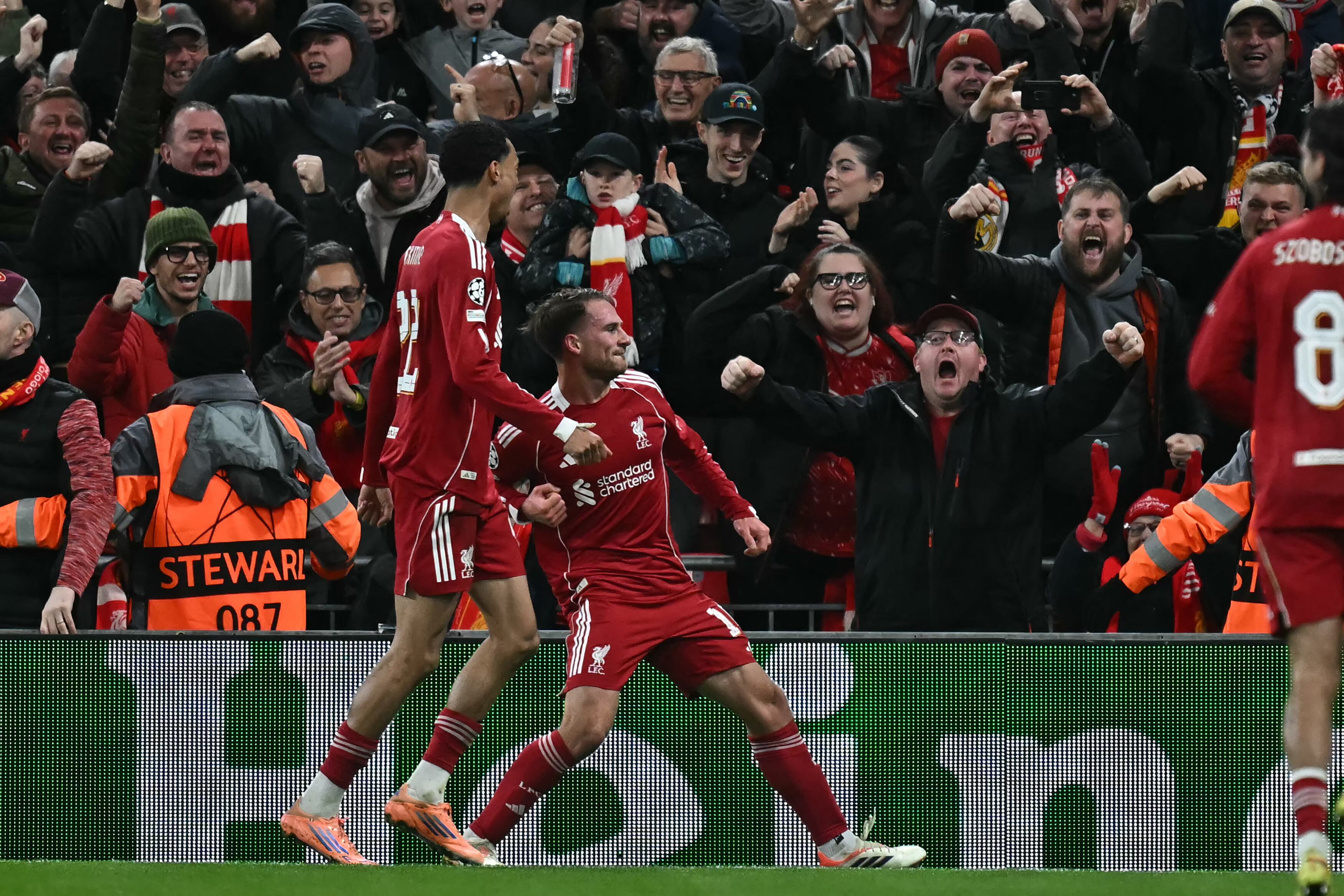 Liverpool's Argentinian midfielder #10 Alexis Mac Allister (C) celebrates after scoring the opening goal of the UEFA Champions League, league phase football match between Liverpool and Real Madrid at Anfield in Liverpool, north west England on November 4, 2025. (Photo by Paul ELLIS / AFP)