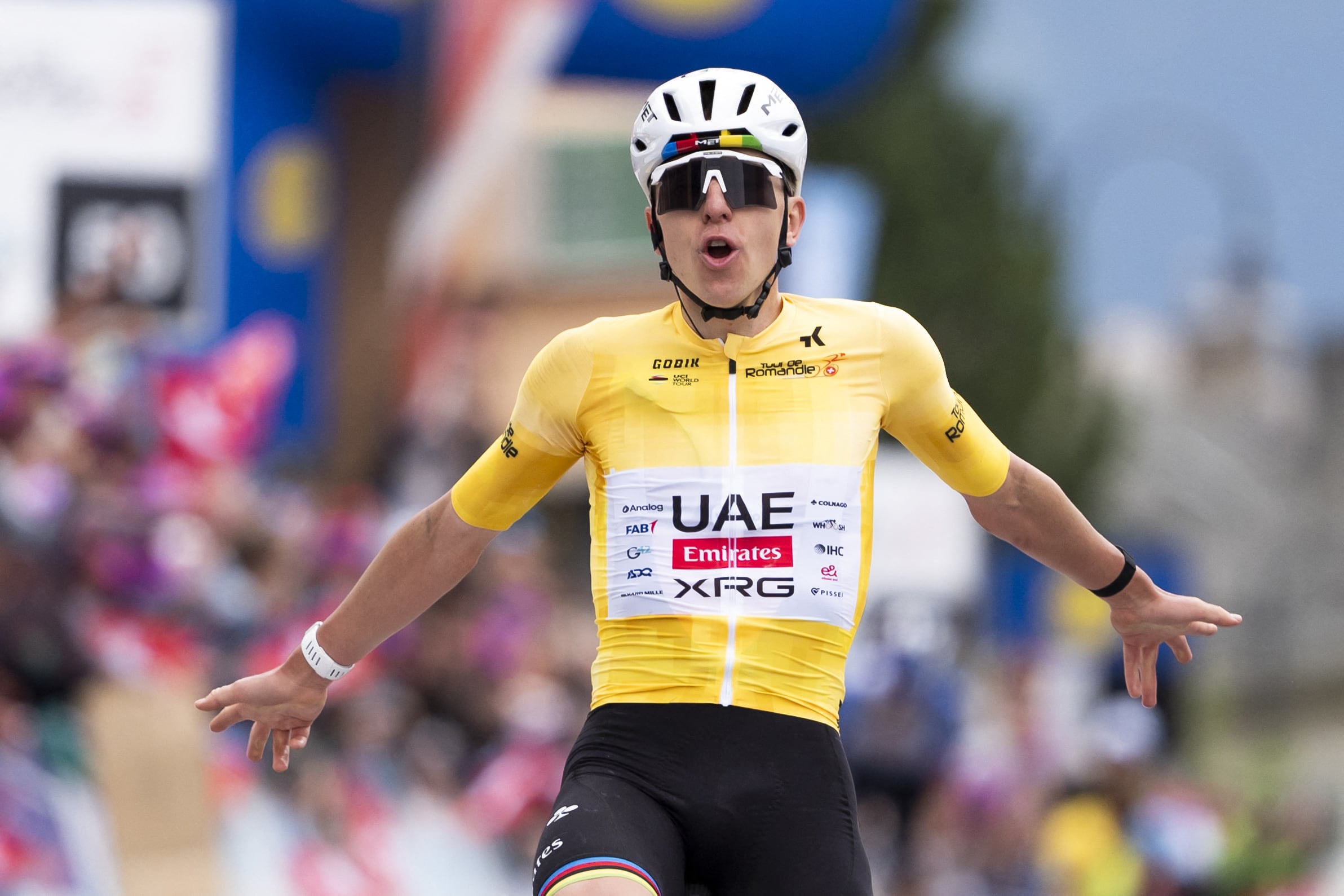 Team Emirates-XRG's Slovenian rider Tadej Pogacar, wearing the overall leader's yellow jersey, as he crosses the finish line to win the final stage of the Tour of Romandie UCI cycling World tour, 178.2 km from Lucens and to Leysin, in Leysin, Switzerland, on May, 3, 2026. (Photo by TIL BUERGY / AFP)