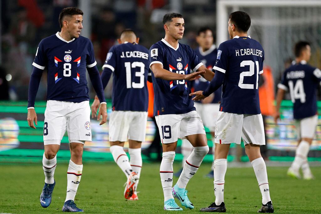 SANTIAGO, CHILE - NOVEMBER 16: Ramon Sosa and Hernesto Caballero of Paraguay shake hands after a FIFA World Cup 2026 Qualifier match between Chile and Paraguay at Estadio Monumental David Arellano on November 16, 2023 in Santiago, Chile. (Photo by Marcelo Hernandez/Getty Images)