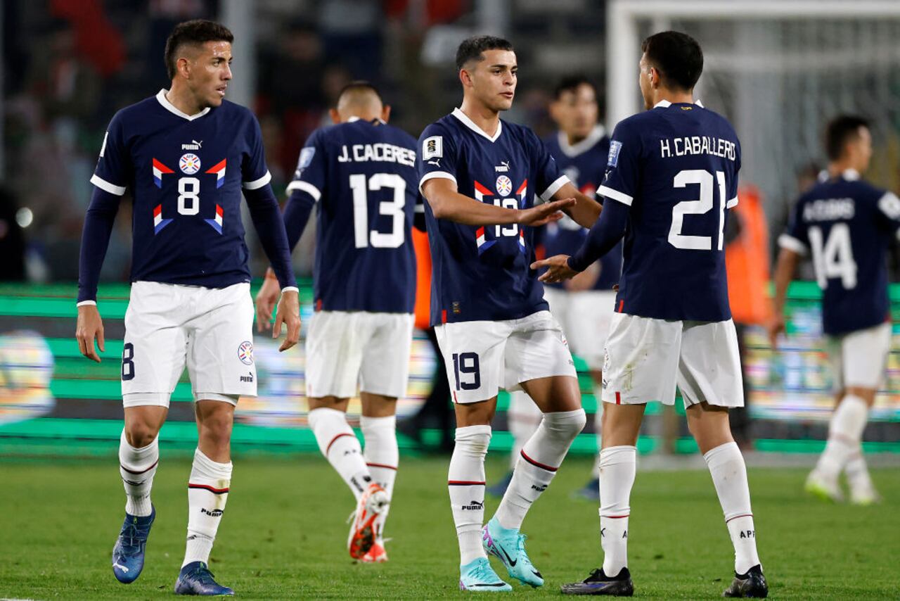 SANTIAGO, CHILE - NOVEMBER 16: Ramon Sosa and Hernesto Caballero of Paraguay shake hands after a FIFA World Cup 2026 Qualifier match between Chile and Paraguay at Estadio Monumental David Arellano on November 16, 2023 in Santiago, Chile. (Photo by Marcelo Hernandez/Getty Images)