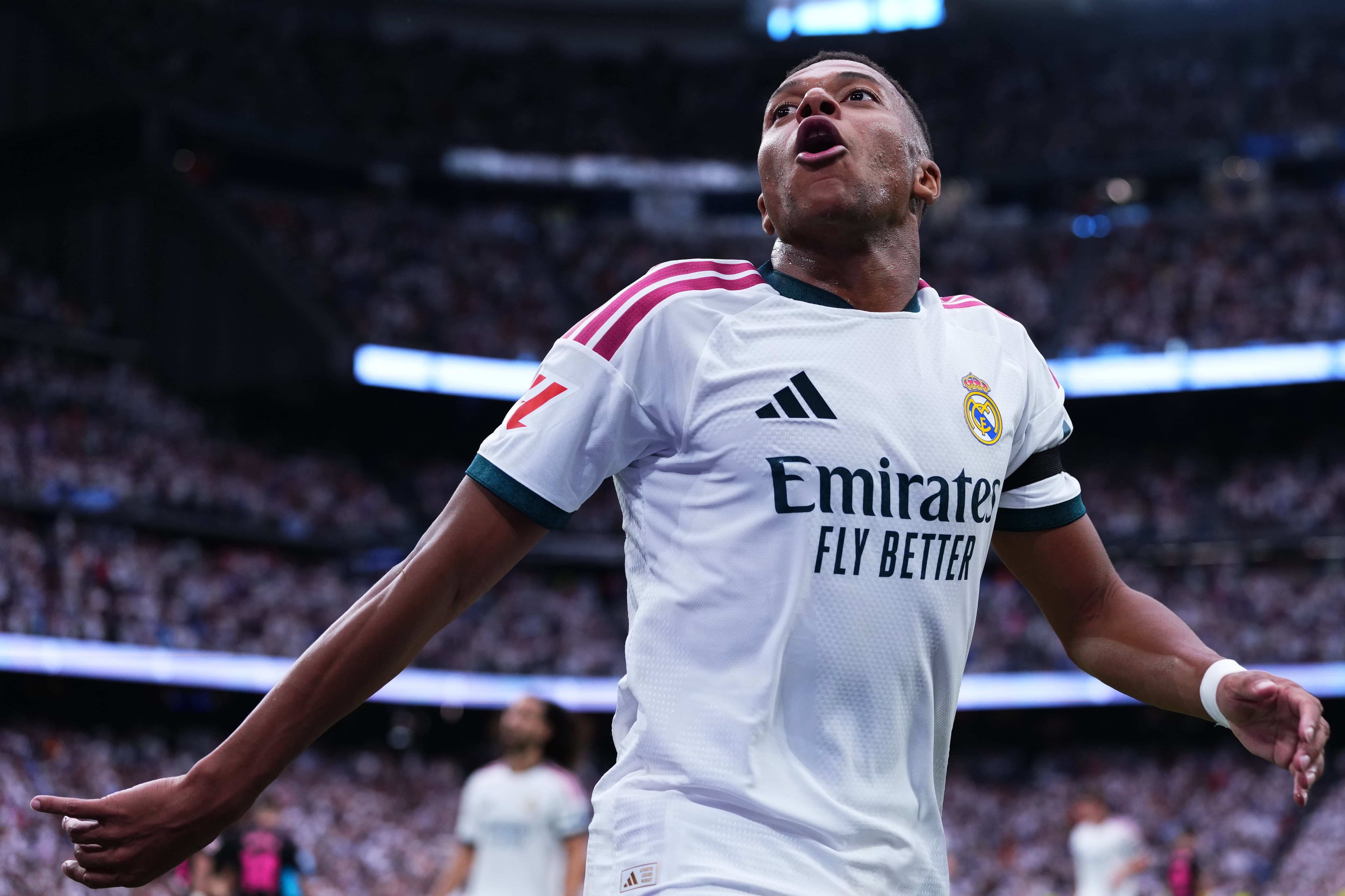 Real Madrid's Kylian Mbappe celebrates after scoring his sides third goal during the La Liga soccer match between Real Madrid and Malaga in Madrid, Spain, Sunday, Aug. 30, 2026. (AP Photo/Manu Fernandez)