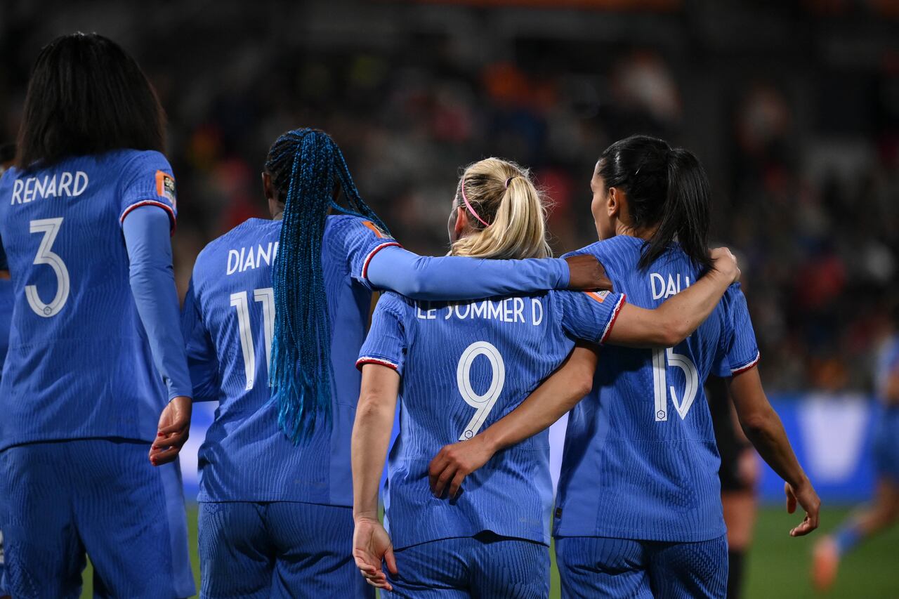 rance's forward #09 Eugenie Le Sommer celebrates with teammates scoring her team's fourth goal during the Australia and New Zealand 2023 Women's World Cup round of 16 football match between France and Morocco at Hindmarsh Stadium in Adelaide on August 8, 2023. (Photo by FRANCK FIFE / AFP)