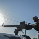 Afghan security personnel and Afghan militia fighting against Taliban, stand guard in Enjil district of Herat province on July 30, 2021. (Photo by Hoshang Hashimi / AFP)