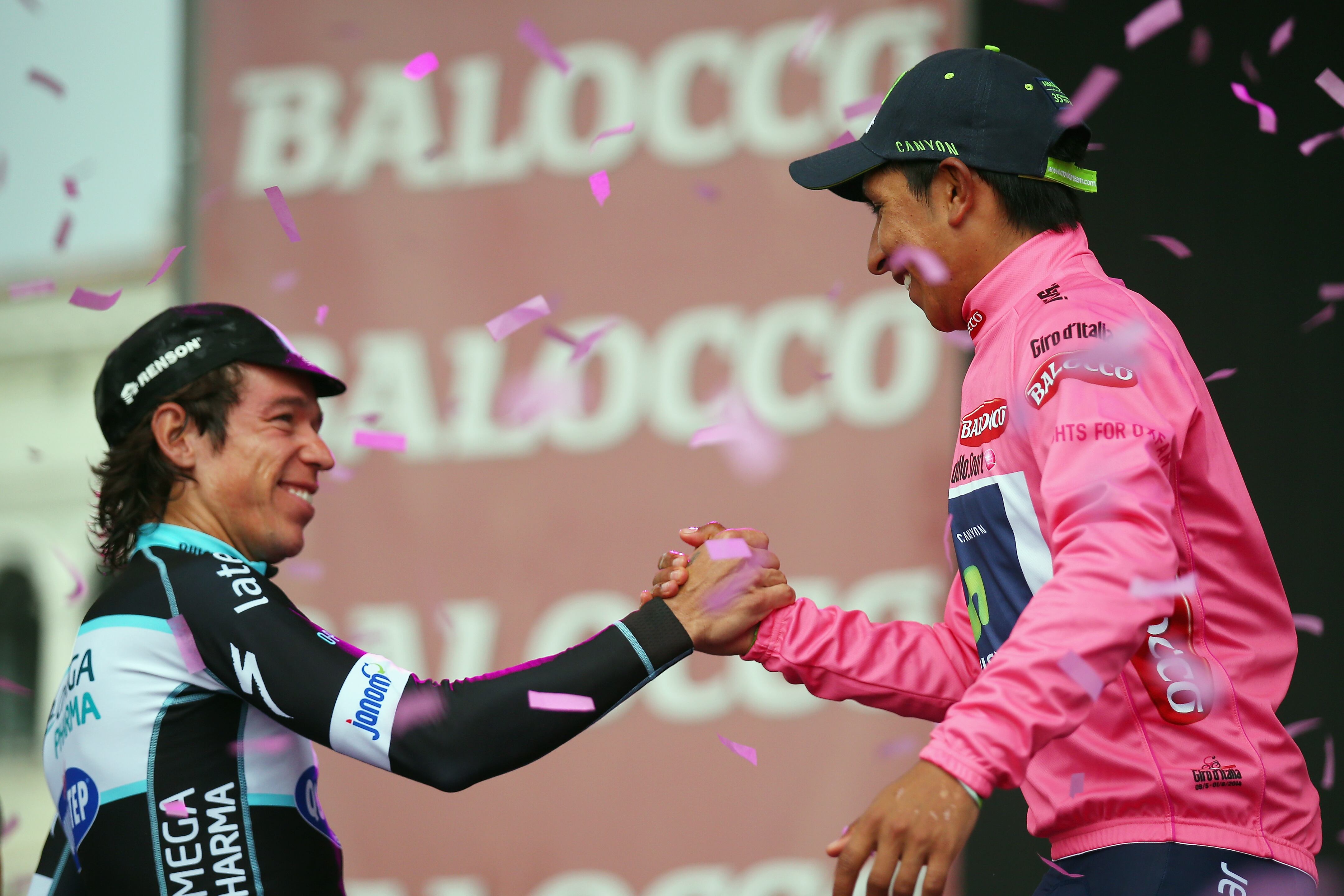 TRIESTE, ITALY - JUNE 01:  Race winner Nairo Quintana of Colombia and the Movistar Team (r) shakes hands with compatriot Rigoberto Uran (2nd place) of team Omega Pharma-QuickStep following the 2014 Giro d'Italia, a 172km stage between Gemona del Friuli and Trieste on June 1, 2014 in Trieste, Italy.  (Photo by Bryn Lennon - Velo/Getty Images)