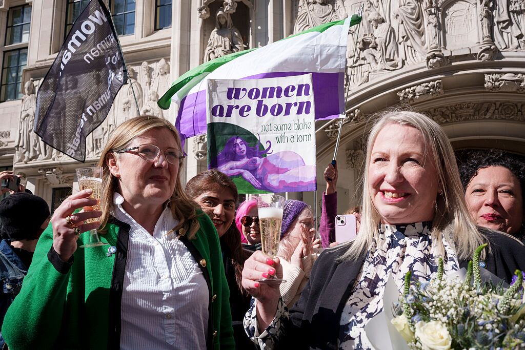 Following the ruling in the Supreme Court that the term 'woman' refers to 'biological women', womens' rights campaigners Susan Smith (in green) and Marion Calder, both directors of 'For Women Scotland' celebrate the judgement outside the court, on 16th April 2025, in London, England. Lord Hodge of the Supreme Court ruled, "The unanimous decision of this court is that the terms woman and sex in the Equality Act 2010 refer to a biological woman and biological sex." (Photo by Richard Baker / In Pictures via Getty Images)