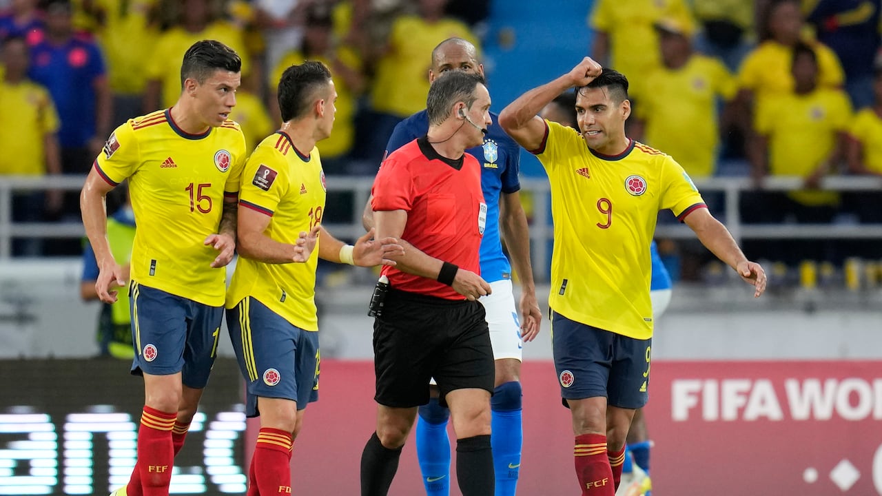 Colombia's Radamel Falcao Garcia asks referee Patricio Loustau, of Argentina, to declare a penalty in favor his team during a qualifying soccer match for the FIFA World Cup Qatar 2022 against Brazil in Barranquilla, Colombia, Sunday, Oct. 10, 2021. (AP Photo/Fernando Vergara)