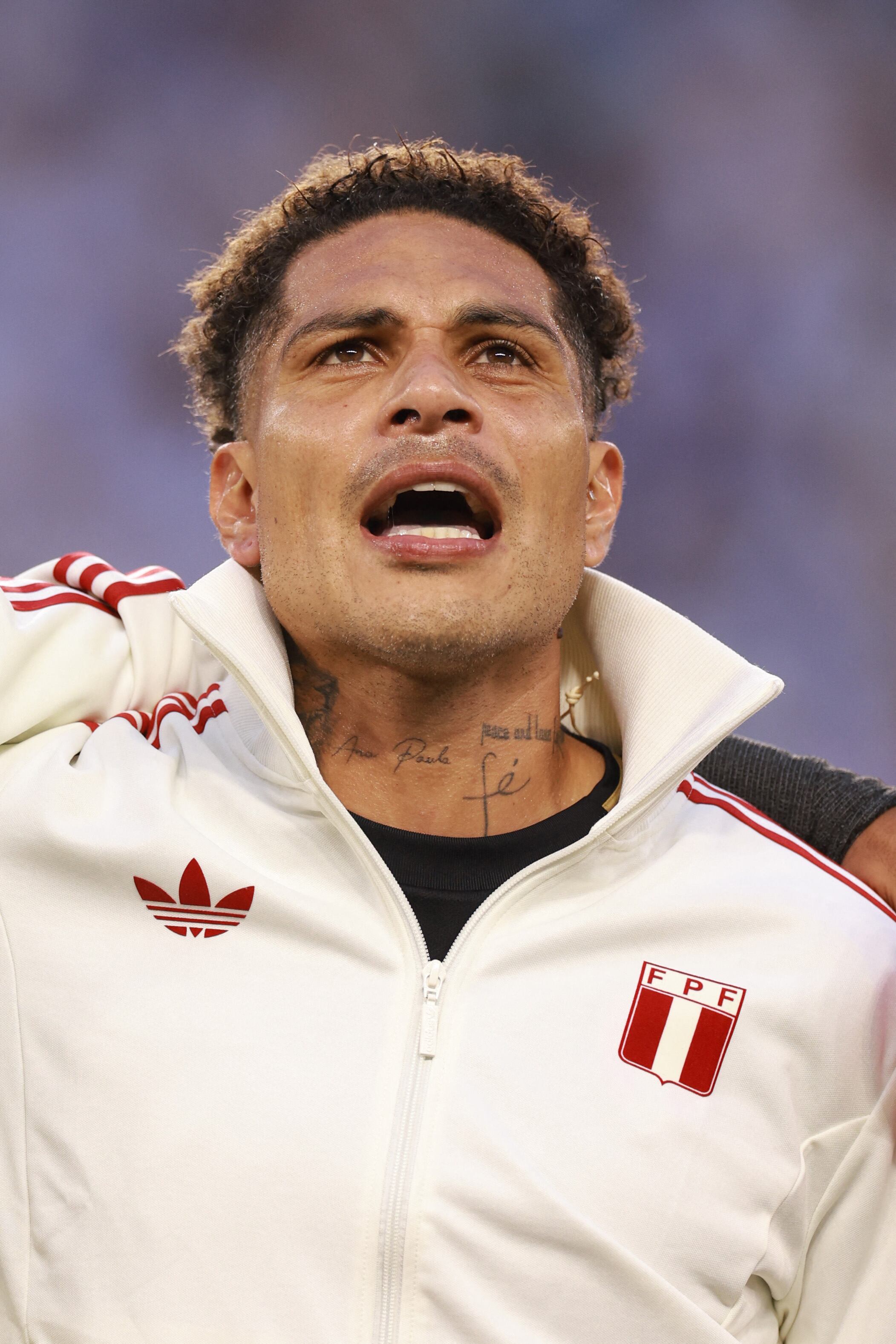 (FILES) MIAMI GARDENS, FLORIDA - JUNE 29: Paolo Guerrero of Peru sings the national anthem prior to the CONMEBOL Copa America 2024 Group A match between Argentina and Peru at Hard Rock Stadium on June 29, 2024 in Miami Gardens, Florida.   Carmen Mandato/Getty Images/AFP. Paolo Guerrero, Peru's all-time leading scorer, announced on January 7 his retirement from the national team after 20 years of playing for the national team. (Photo by Carmen Mandato / GETTY IMAGES NORTH AMERICA / AFP)